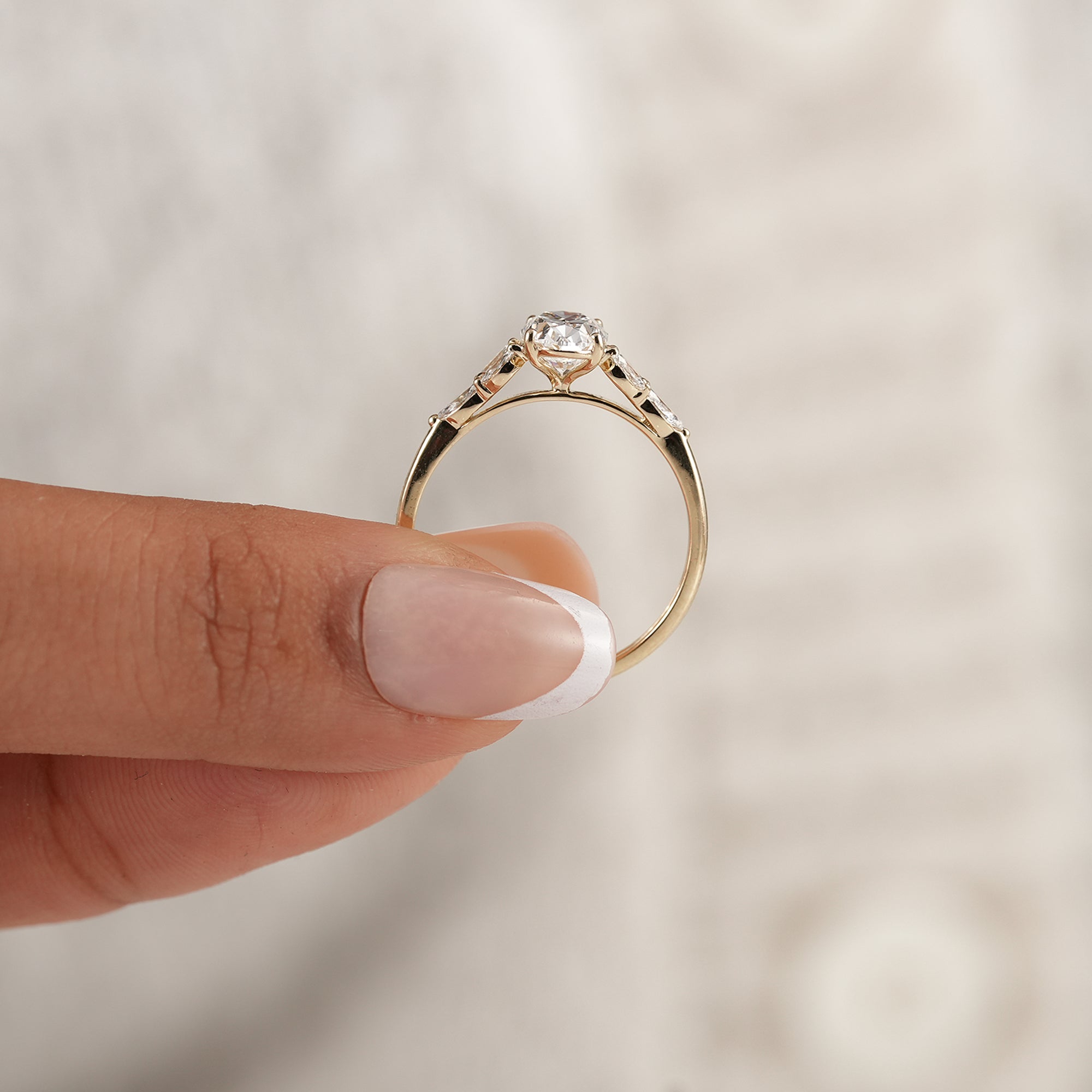 Women's oval floral engagement ring with IGI certified diamond