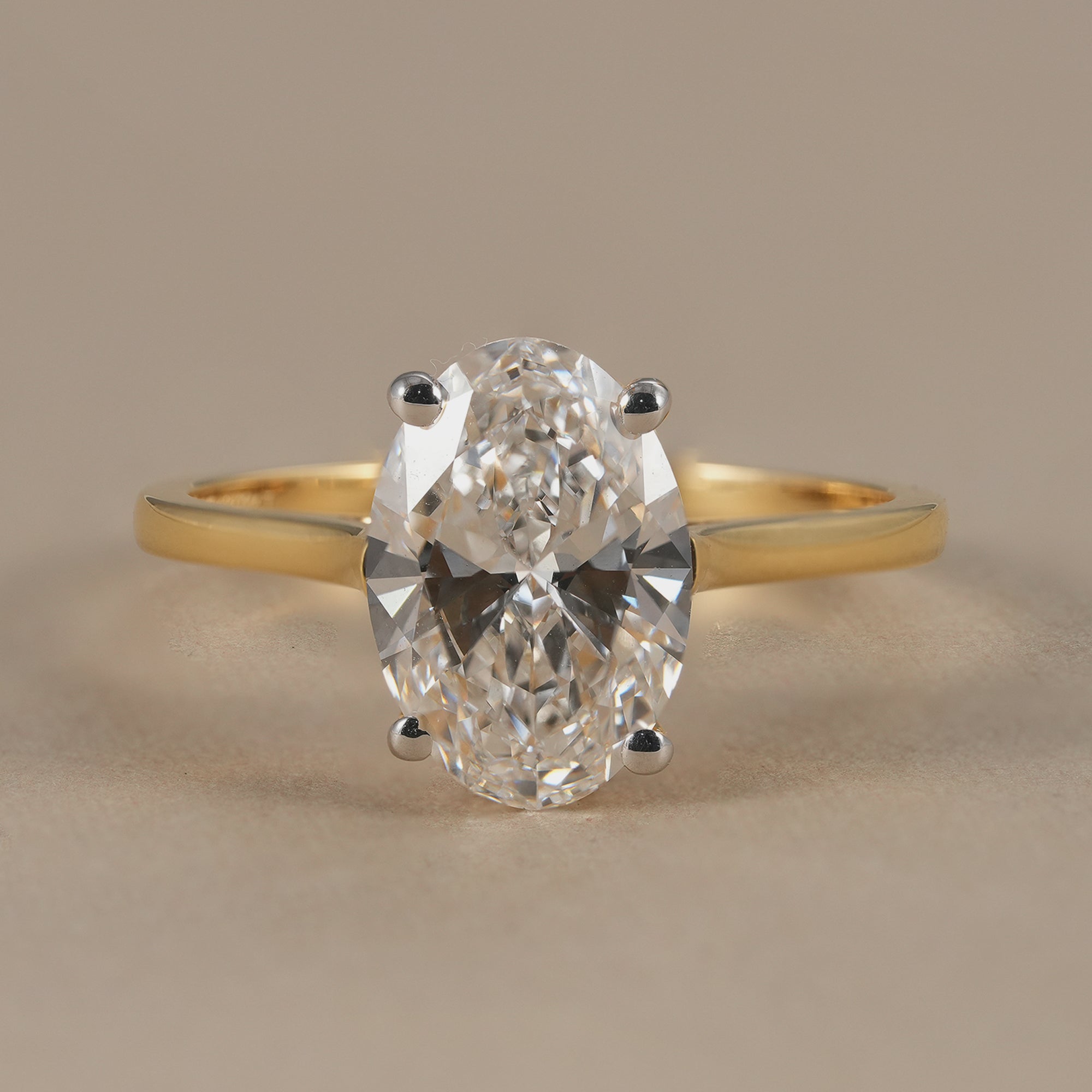 Oval lab grown diamond solitaire engagement ring in yellow gold
