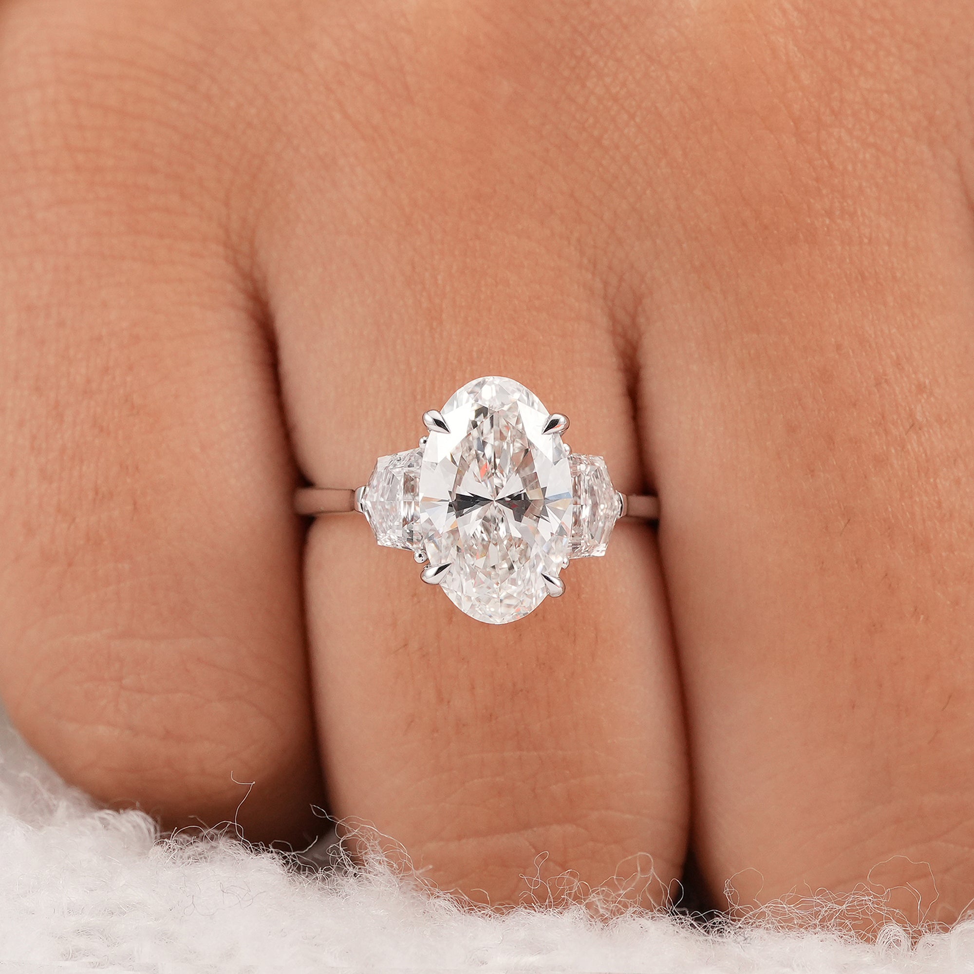 Oval Lab Grown Diamond Three Stone Engagement Ring with Cadillac Side Diamonds