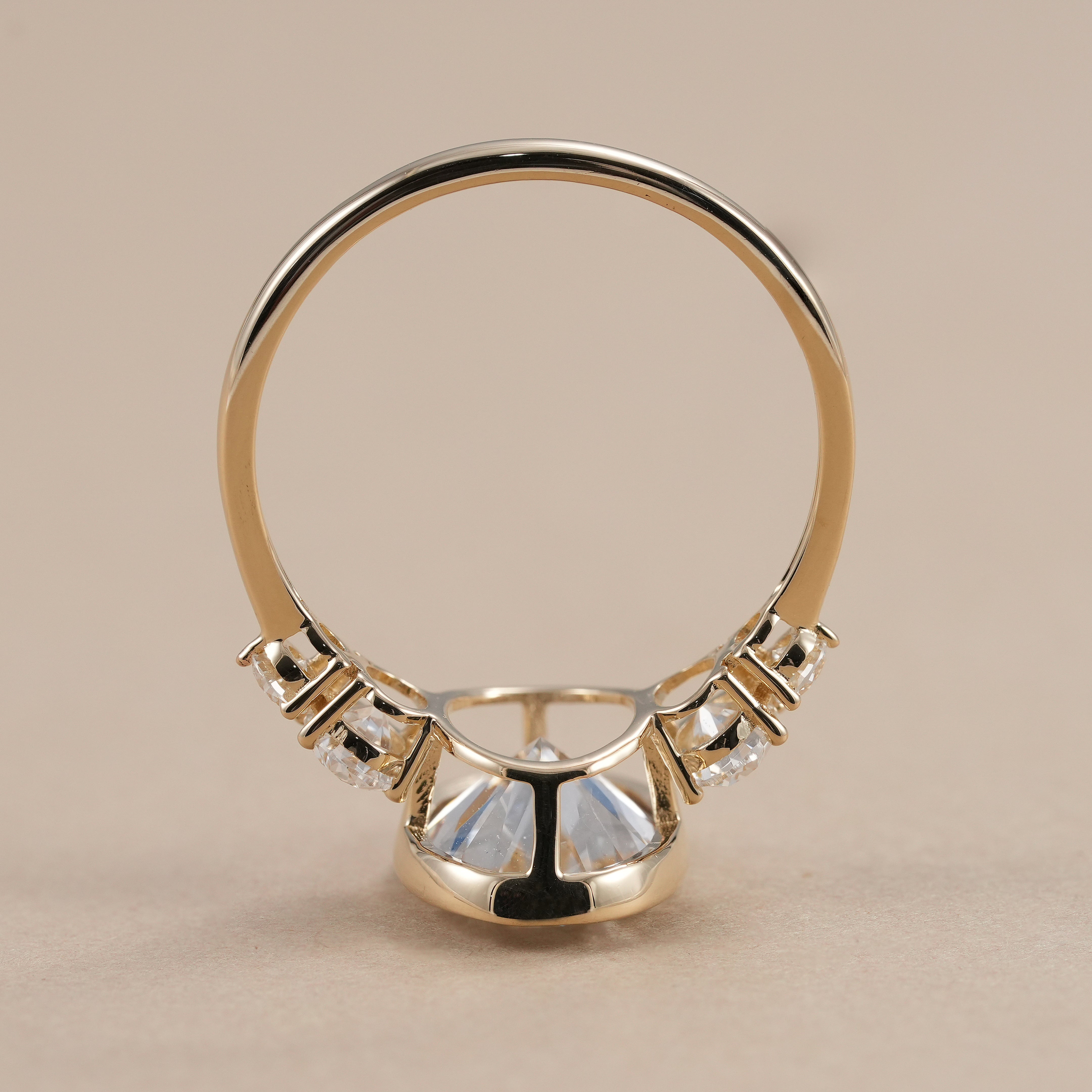 Oval bezel set diamond engagement ring with side diamonds