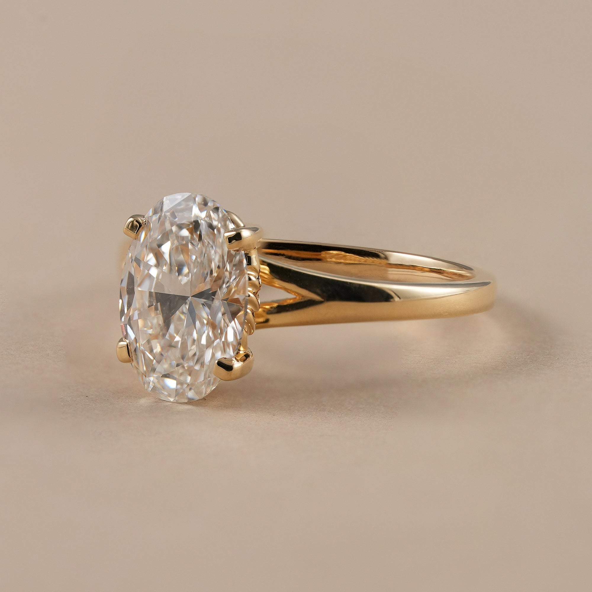 Four prong oval solitaire lab diamond engagement ring