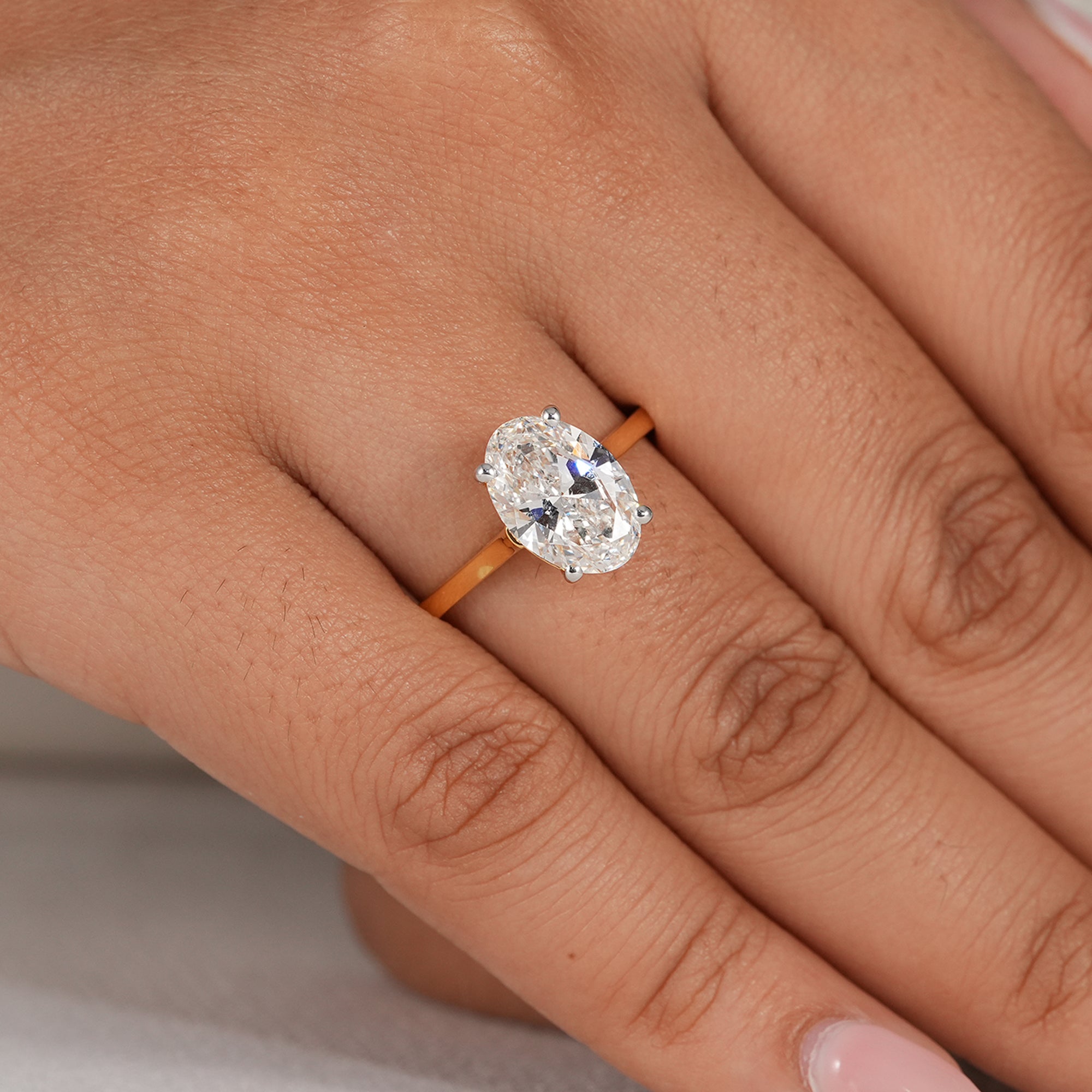 Elegant oval diamond solitaire ring with four prong setting