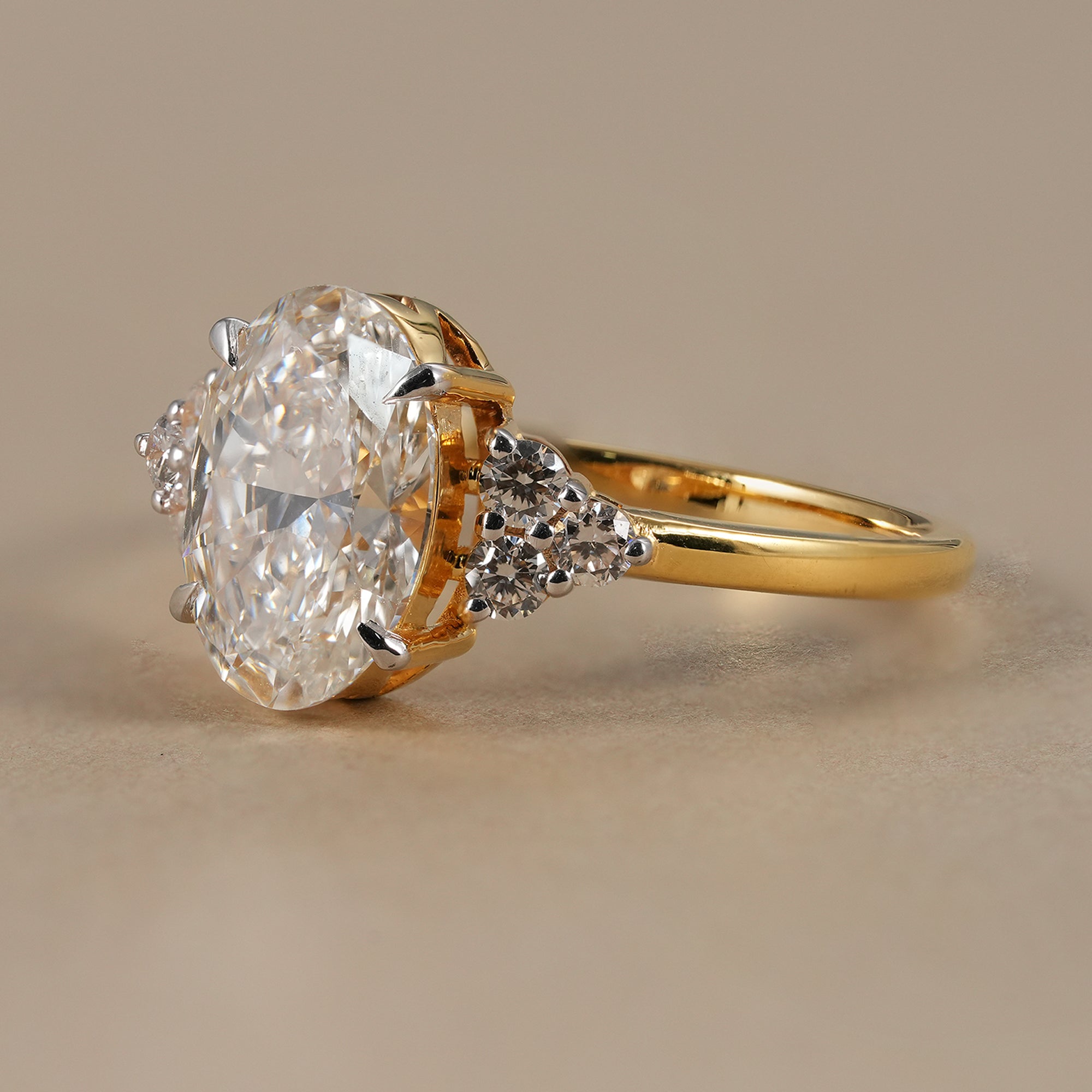 IGI certified oval diamond ring with round accent stones