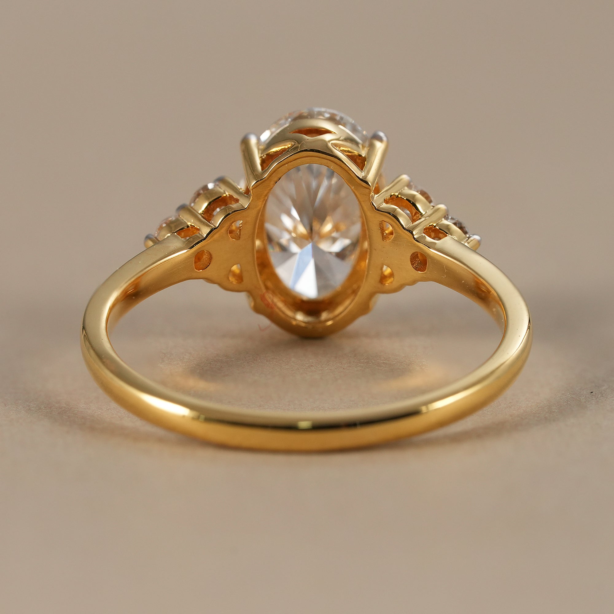 Elegant oval engagement ring with round diamond accents