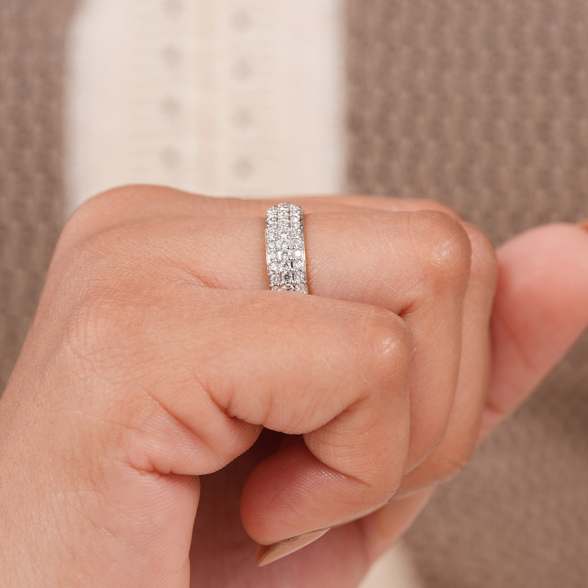 Wide stackable diamond ring designed with brilliant triple row pave setting.