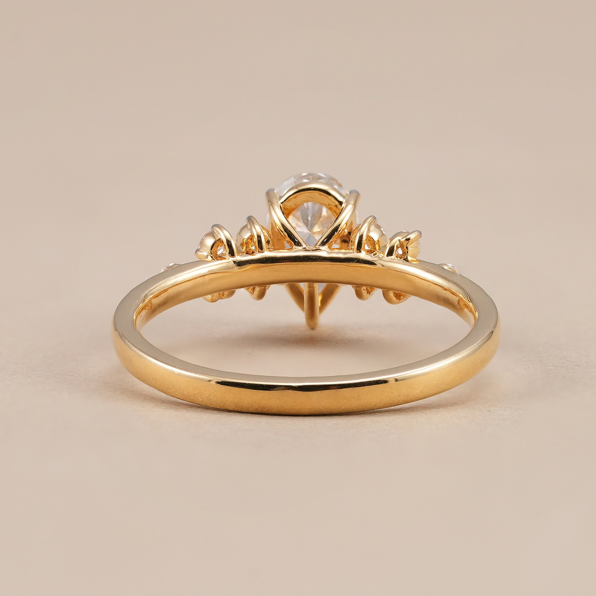 Handcrafted pear diamond wedding ring in yellow gold