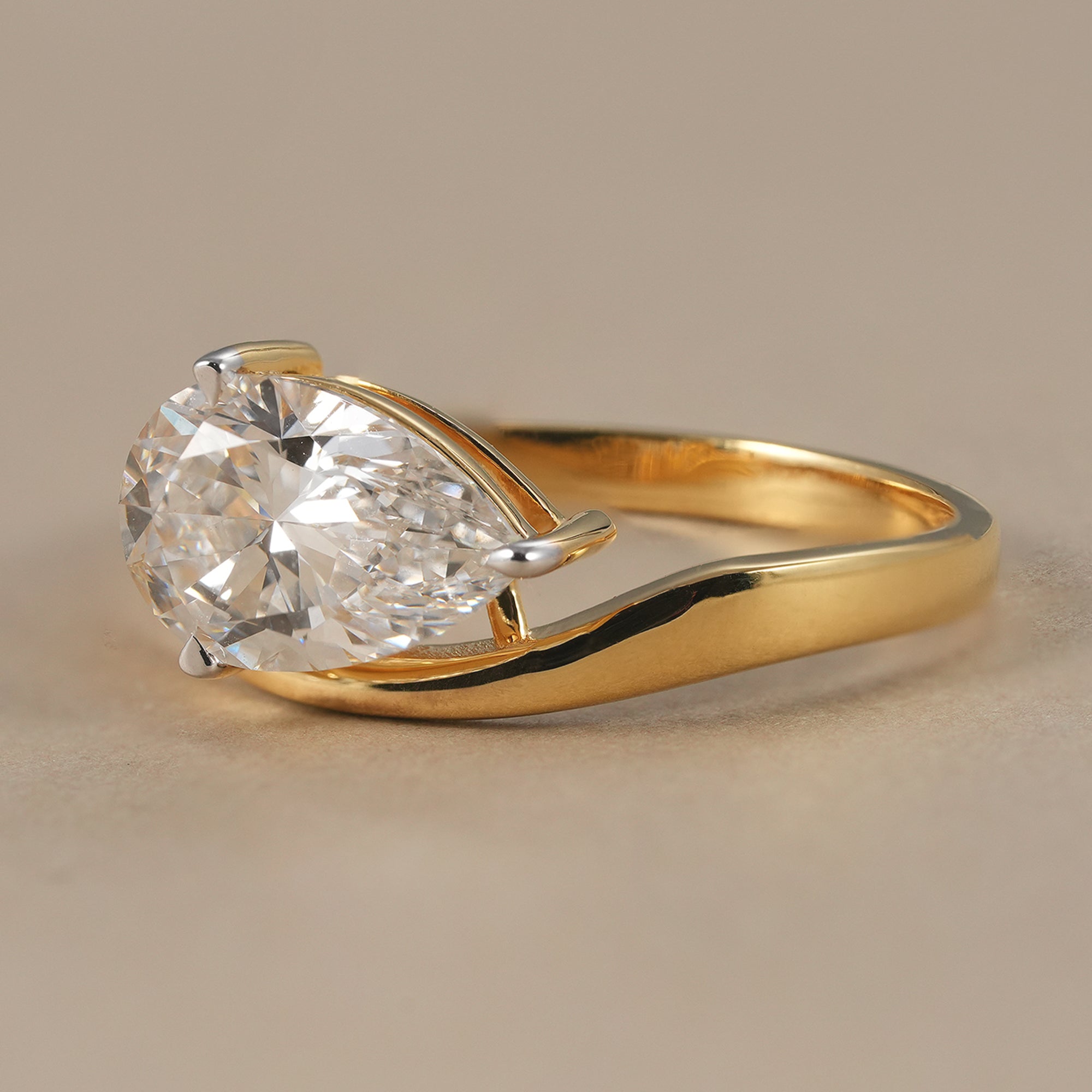 Pear cut lab grown diamond bypass ring in solid gold