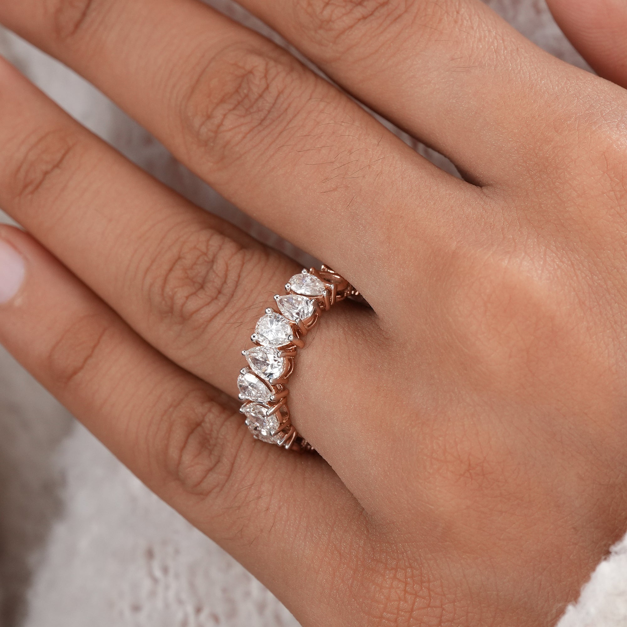 Sustainable pear lab diamond wedding ring.