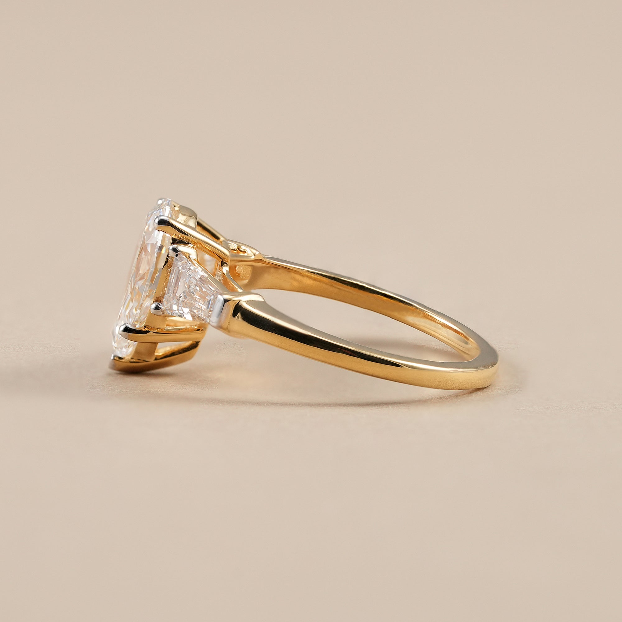 Elegant pear engagement ring with three stone diamond design
