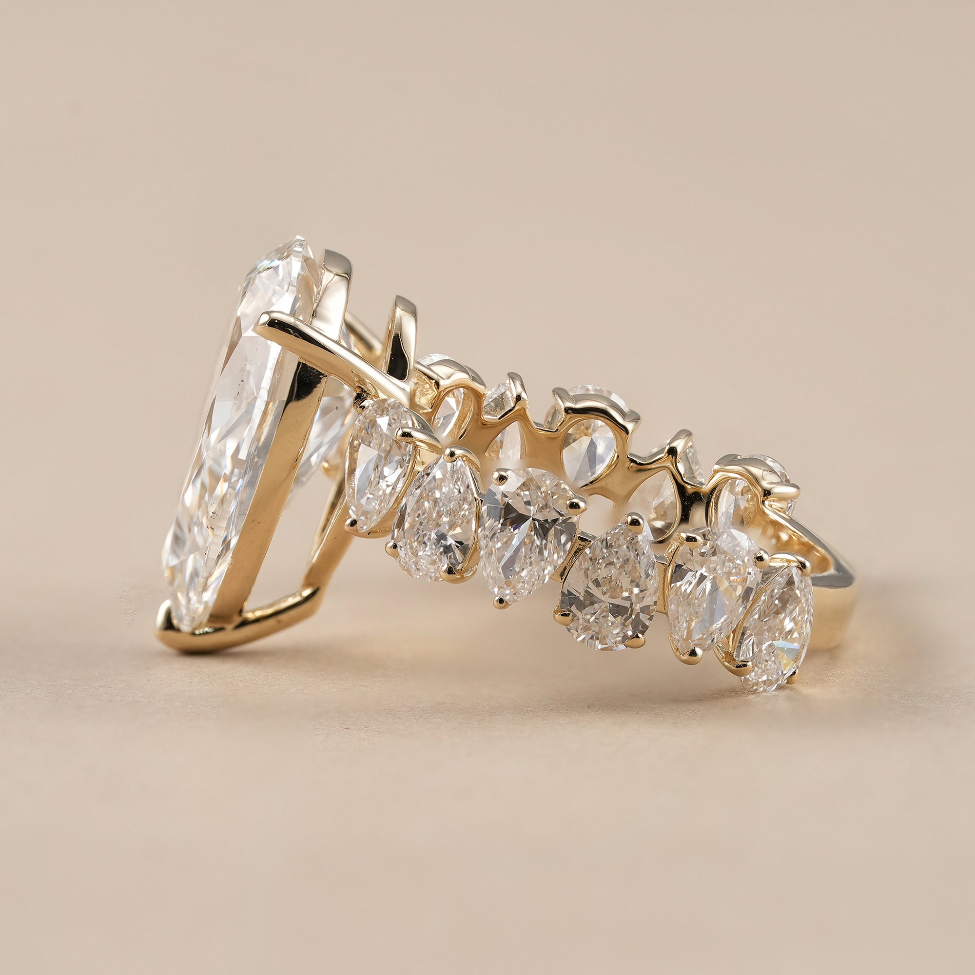 Pear lab diamond engagement ring with side stone setting