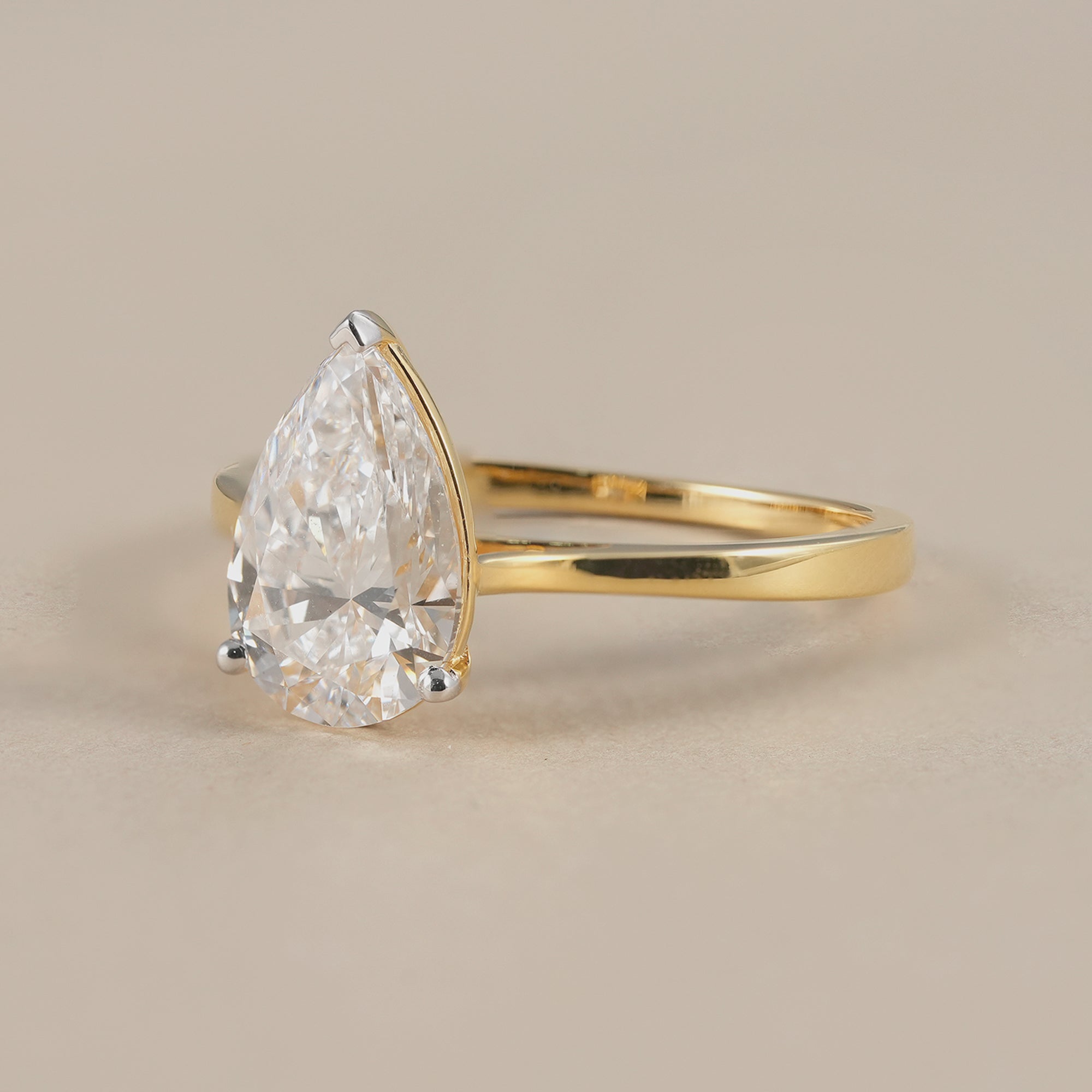 Elegant pear cut diamond proposal ring for women