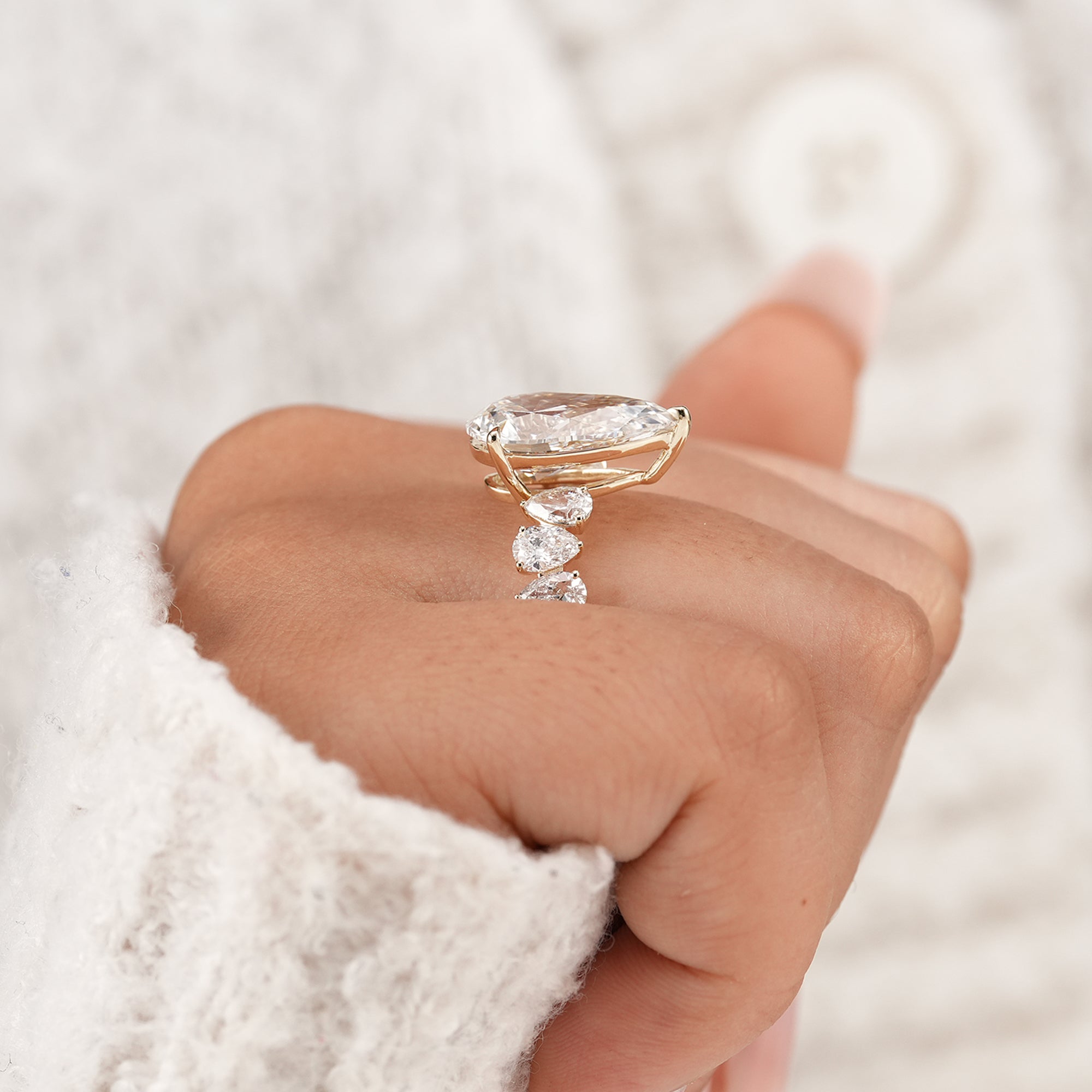Sustainable pear lab grown diamond ring with side diamonds
