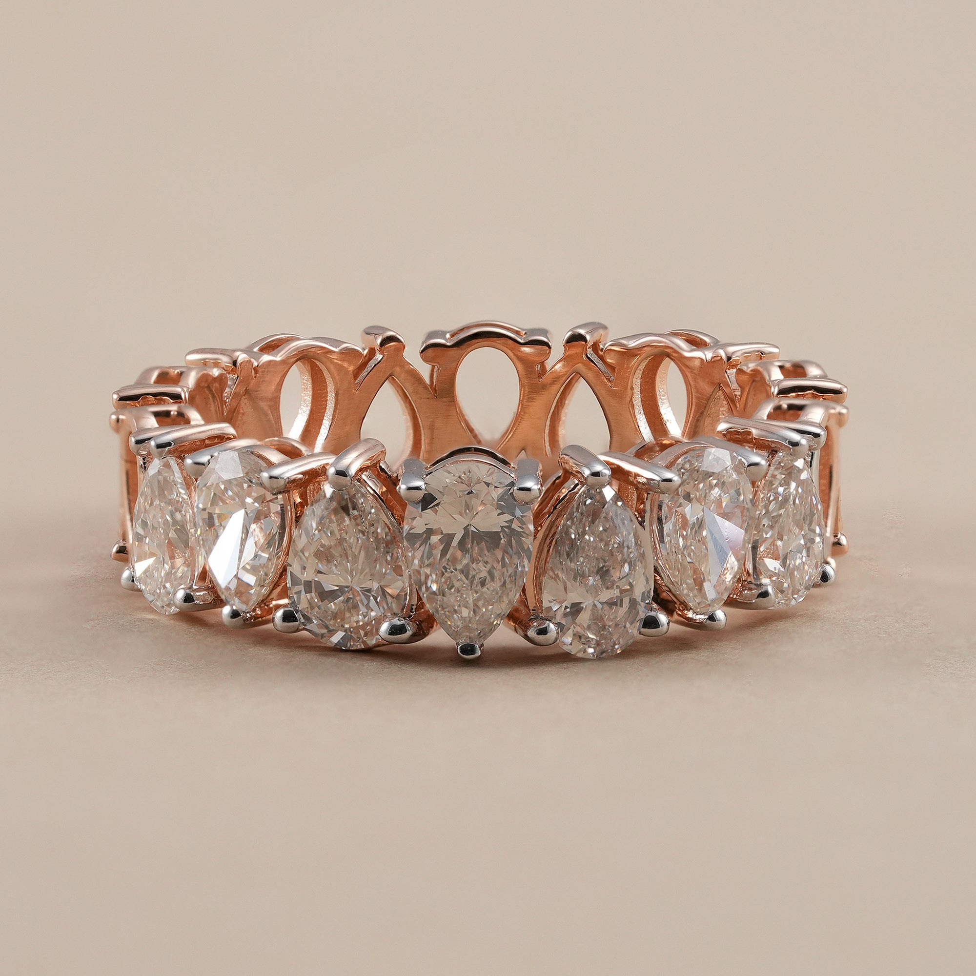 Pear diamond eternity band with lab grown diamonds in rose gold.