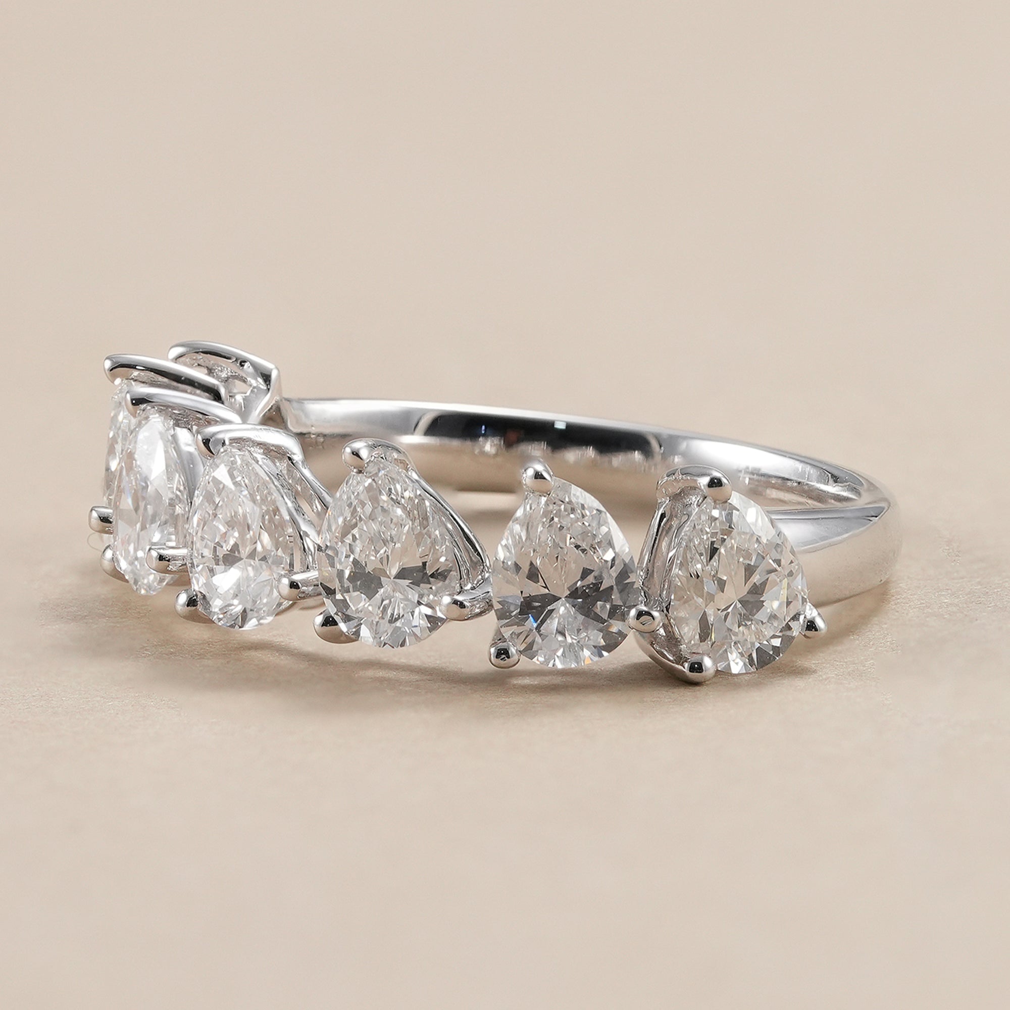 Pear lab grown diamond eternity ring with shared prong setting.