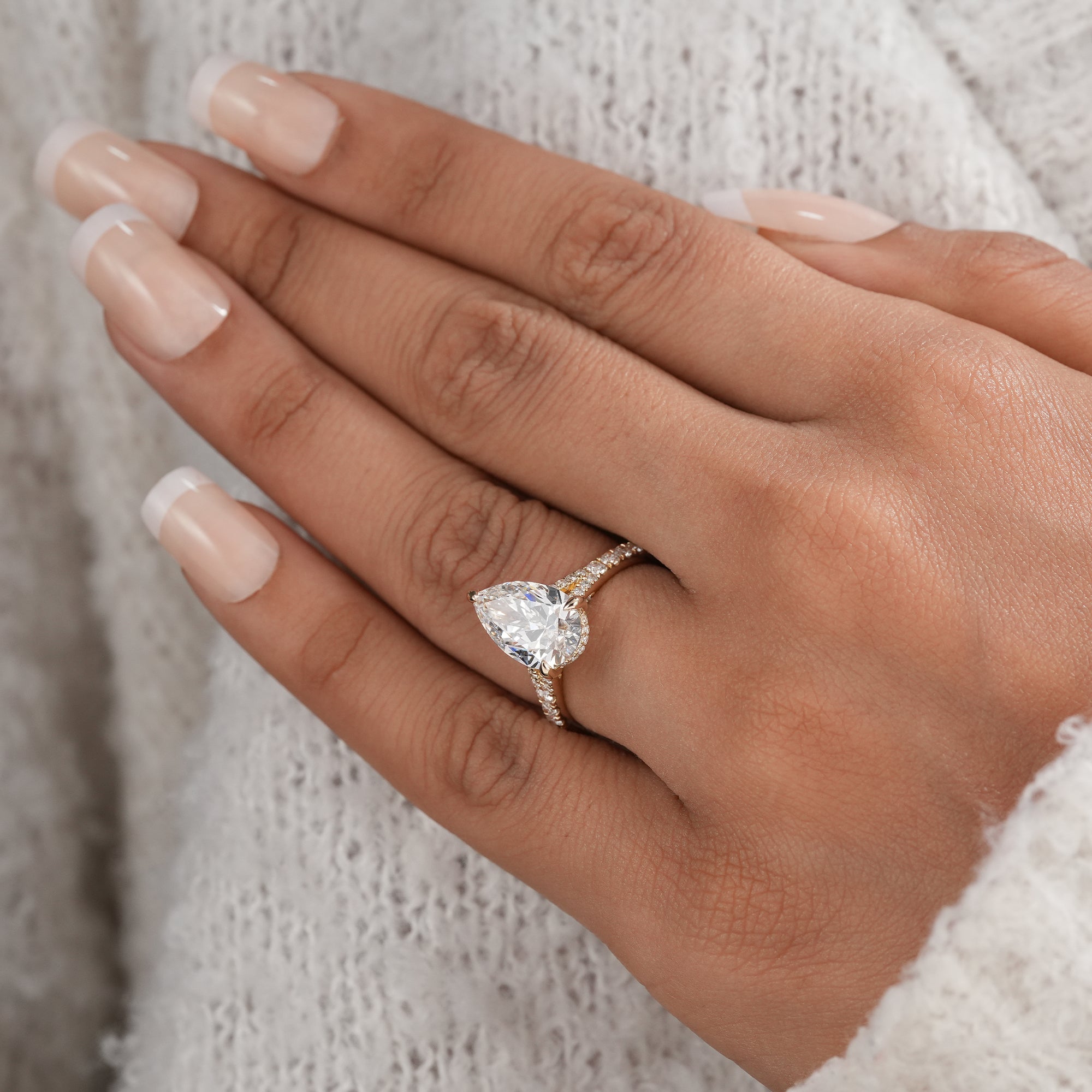 Pear shaped lab diamond ring with split shank band