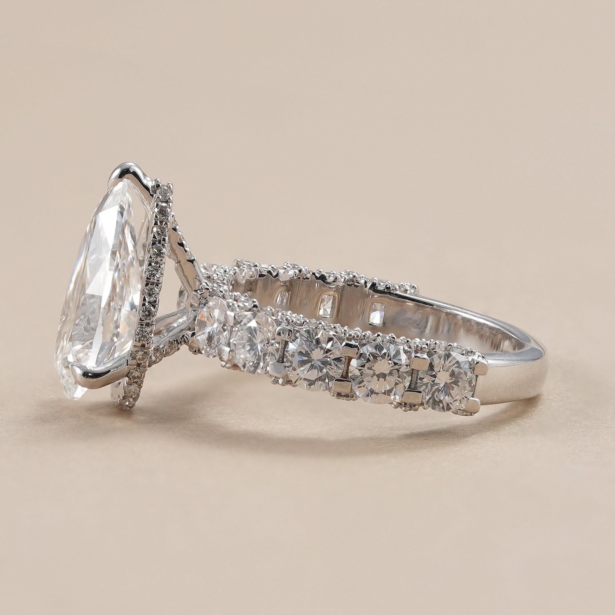 Pear brilliant cut lab grown diamond ring with full diamond band.