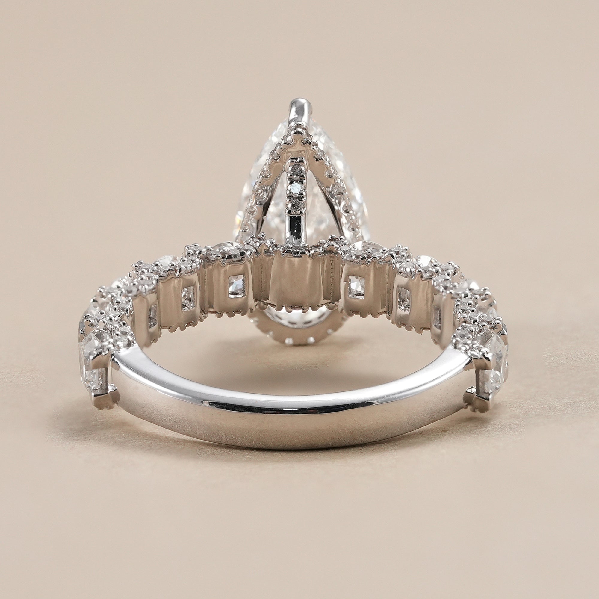 Luxury pear hidden halo engagement ring for women.