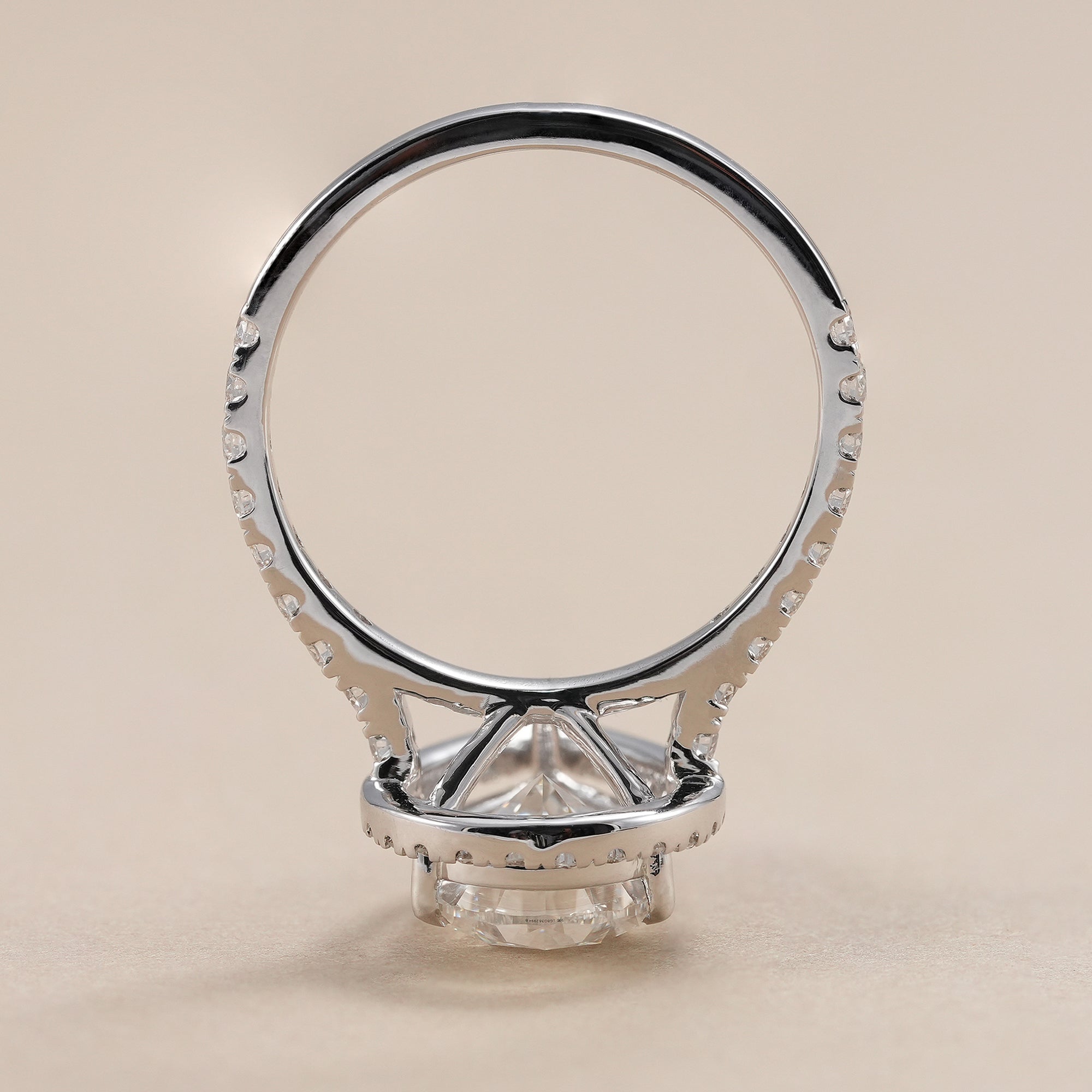 Halo engagement ring with sparkling pave diamond band.