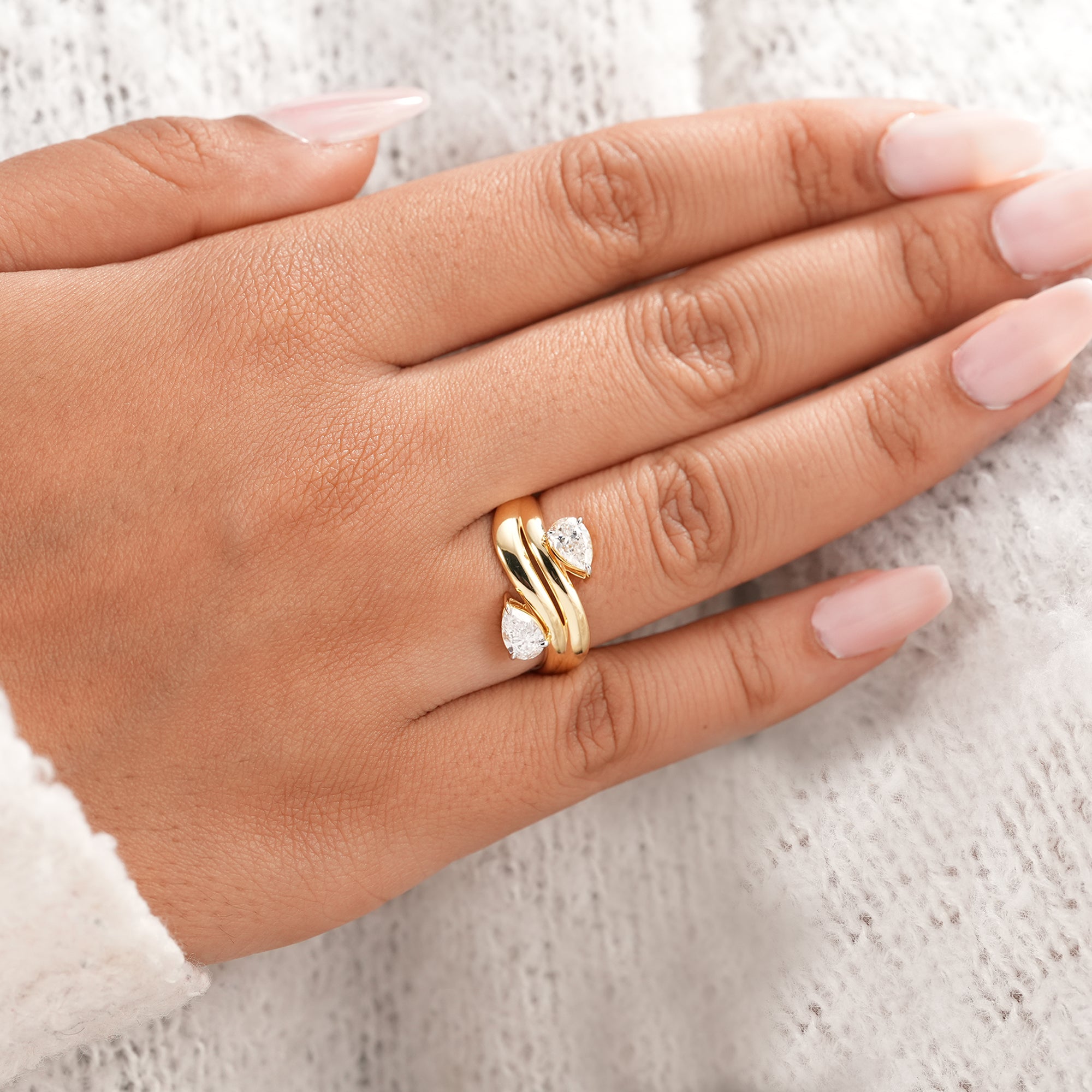Elegant pear diamond statement ring with chunky curved gold band