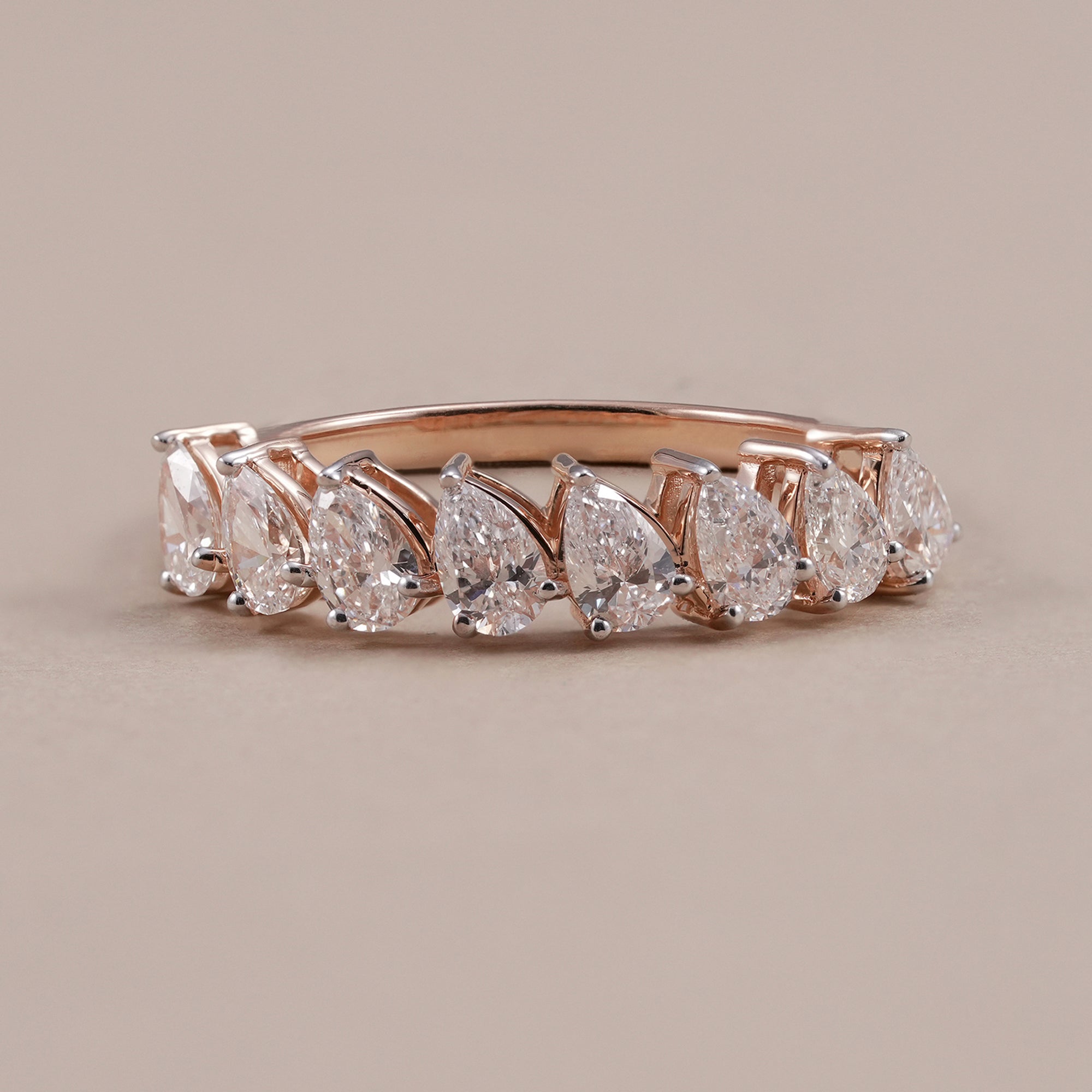 Pear lab grown diamond eternity ring in rose gold half eternity wedding band
