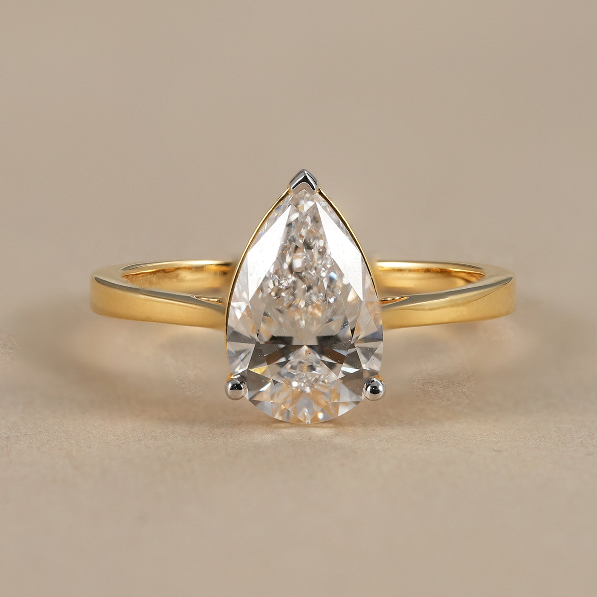 Pear lab grown diamond solitaire engagement ring in solid yellow gold