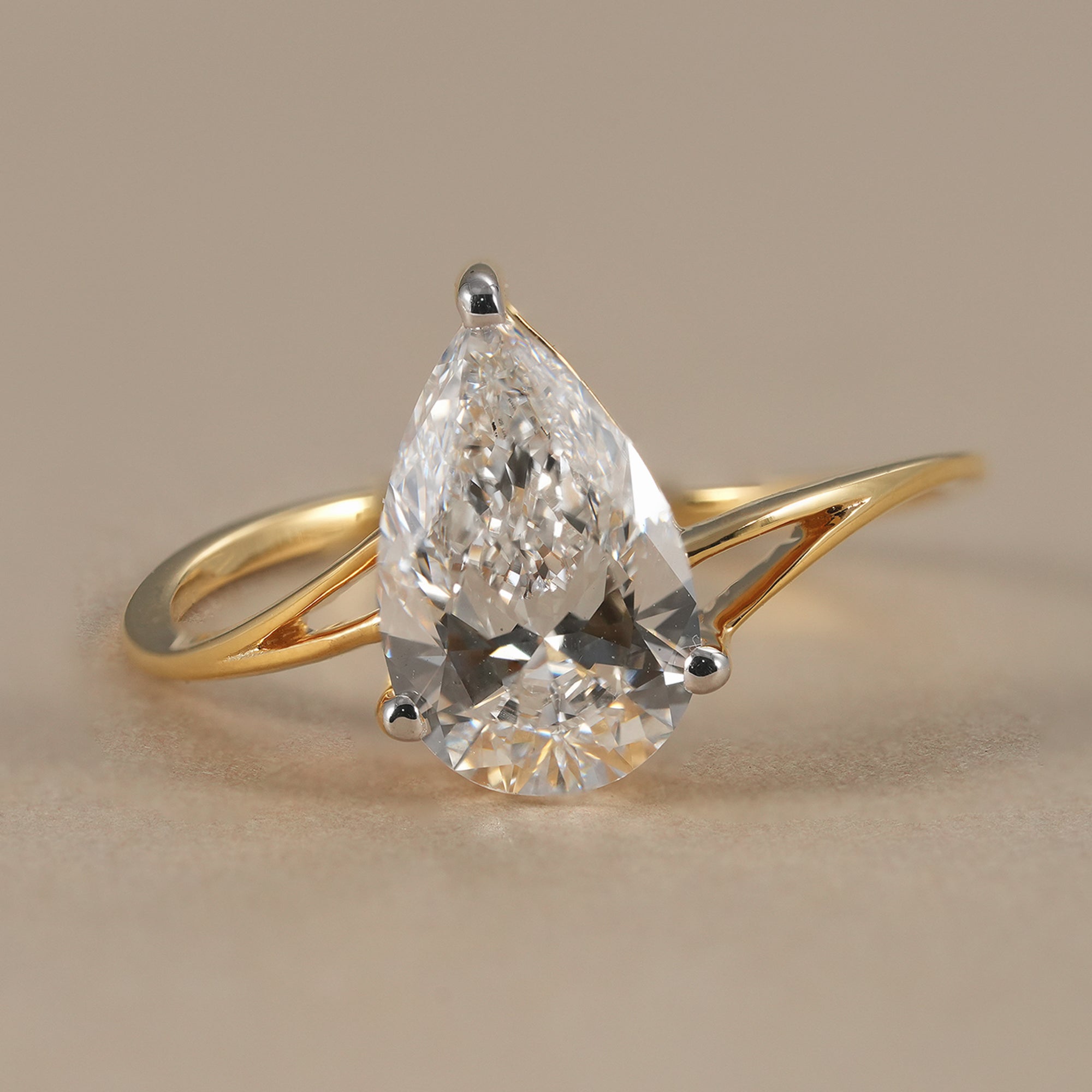 Pear lab grown diamond split shank engagement ring in yellow gold