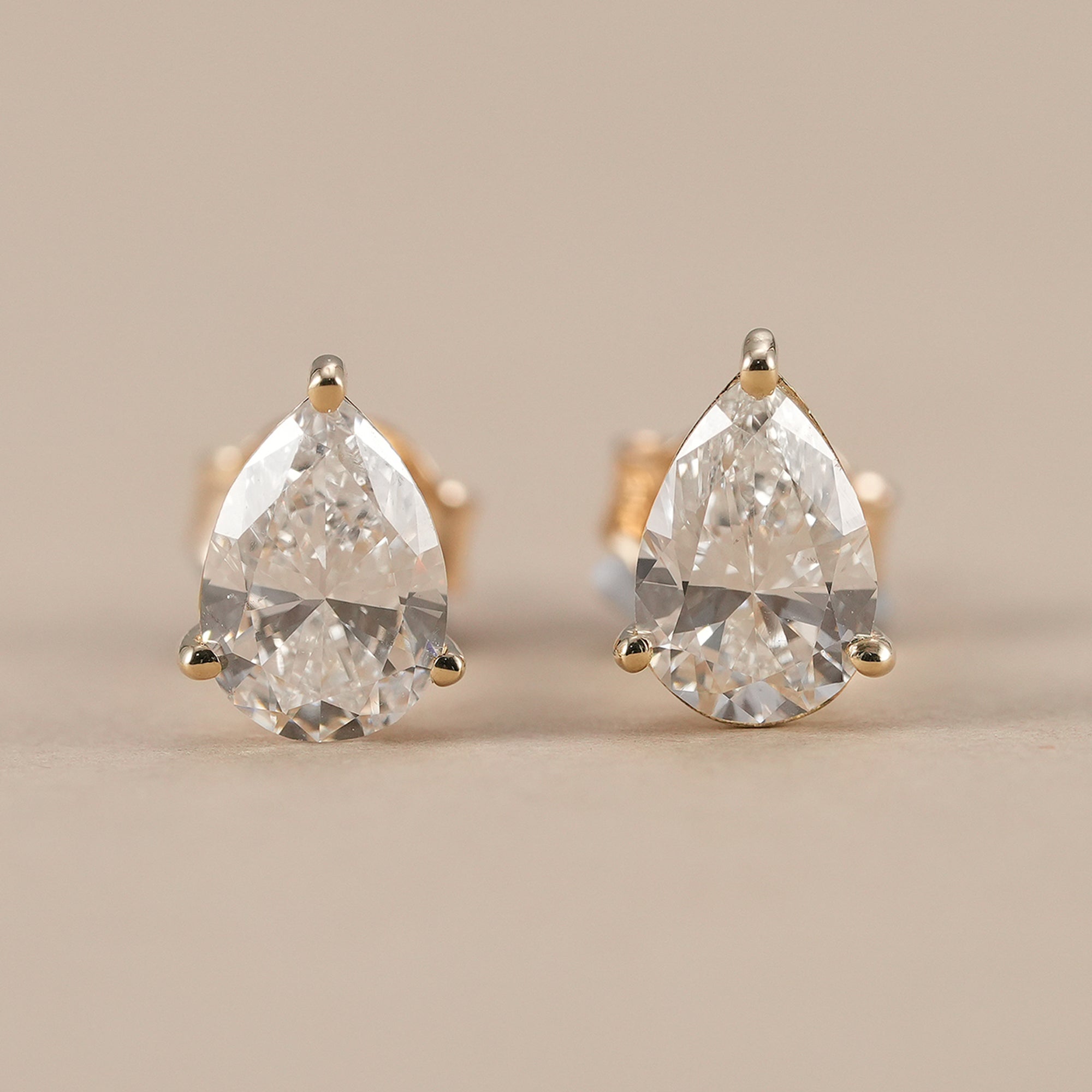 Pear lab grown diamond stud earrings in solid gold