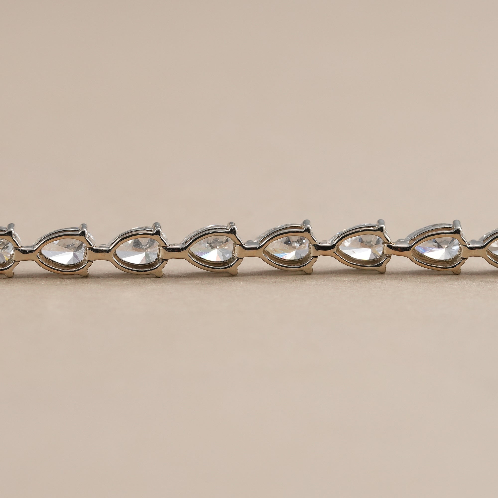 Pear-shaped lab diamond bracelet with classic tennis design.