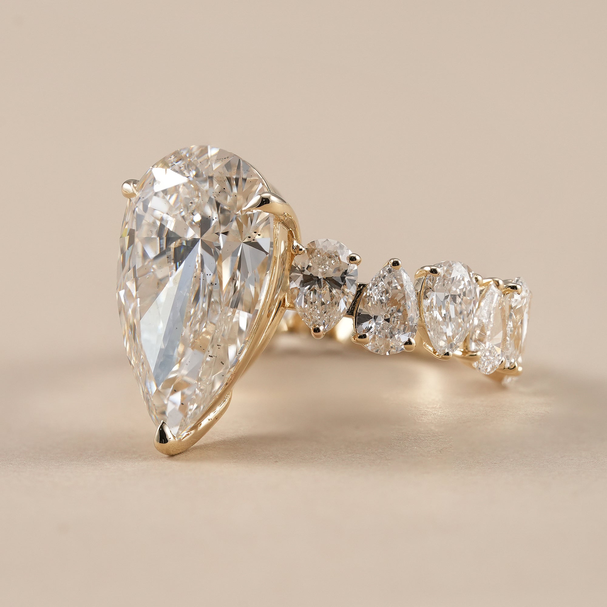 Pear cut solitaire diamond ring in yellow gold