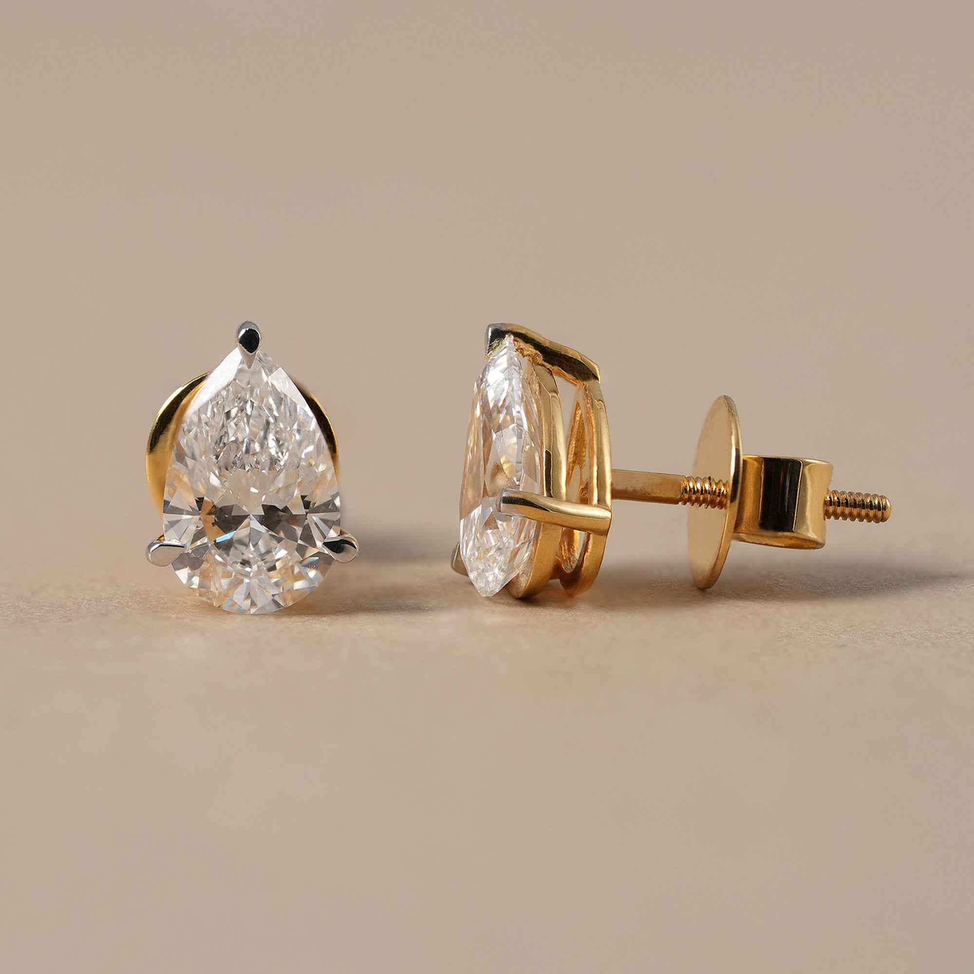 Pear solitaire diamond stud earrings for everyday wear
