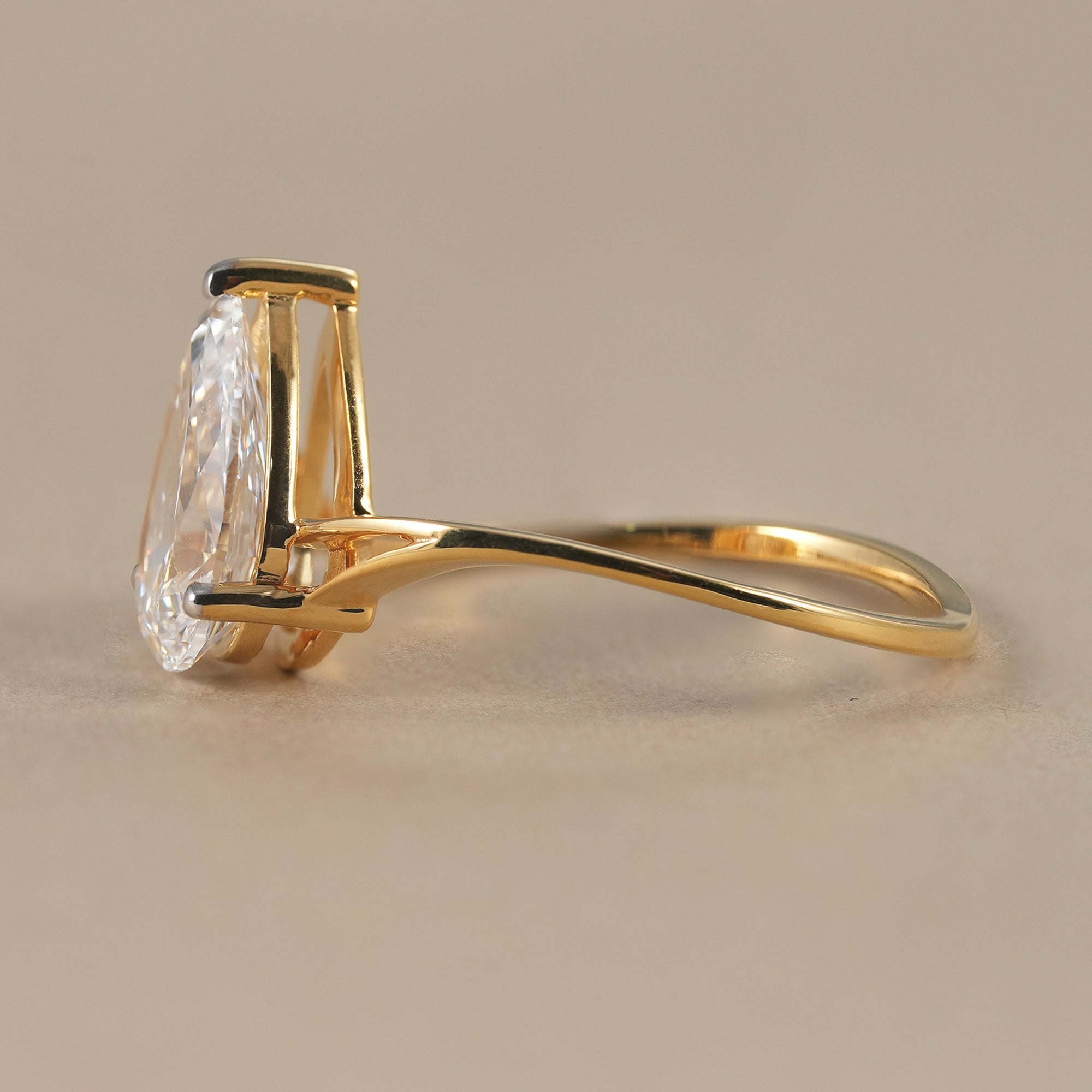 Pear cut lab grown diamond proposal ring in solid gold