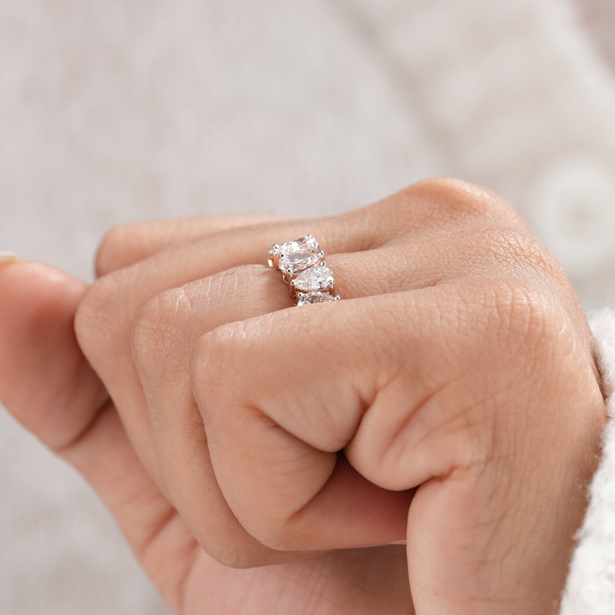 Pear cut lab diamond anniversary ring.