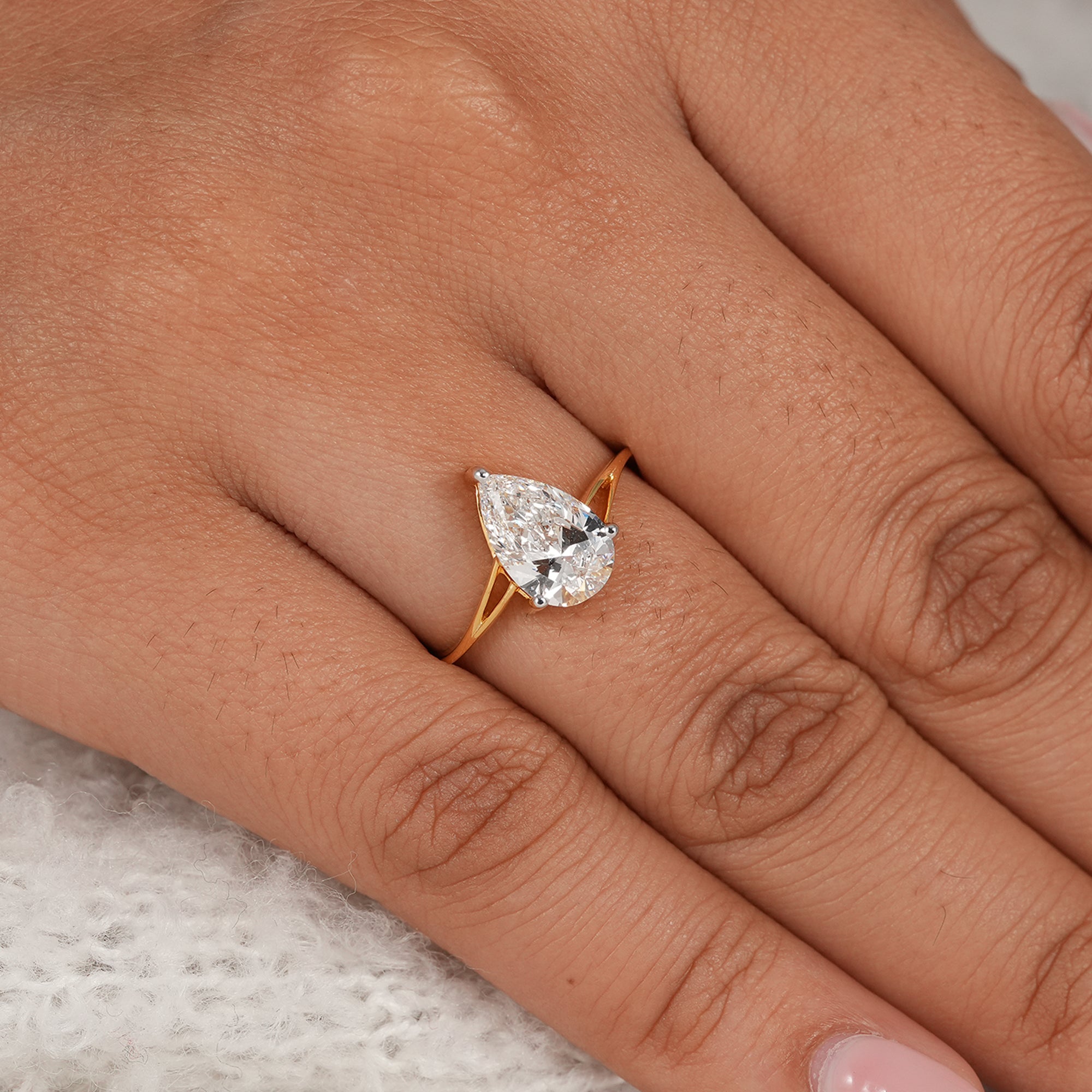 Modern split shank pear solitaire engagement ring