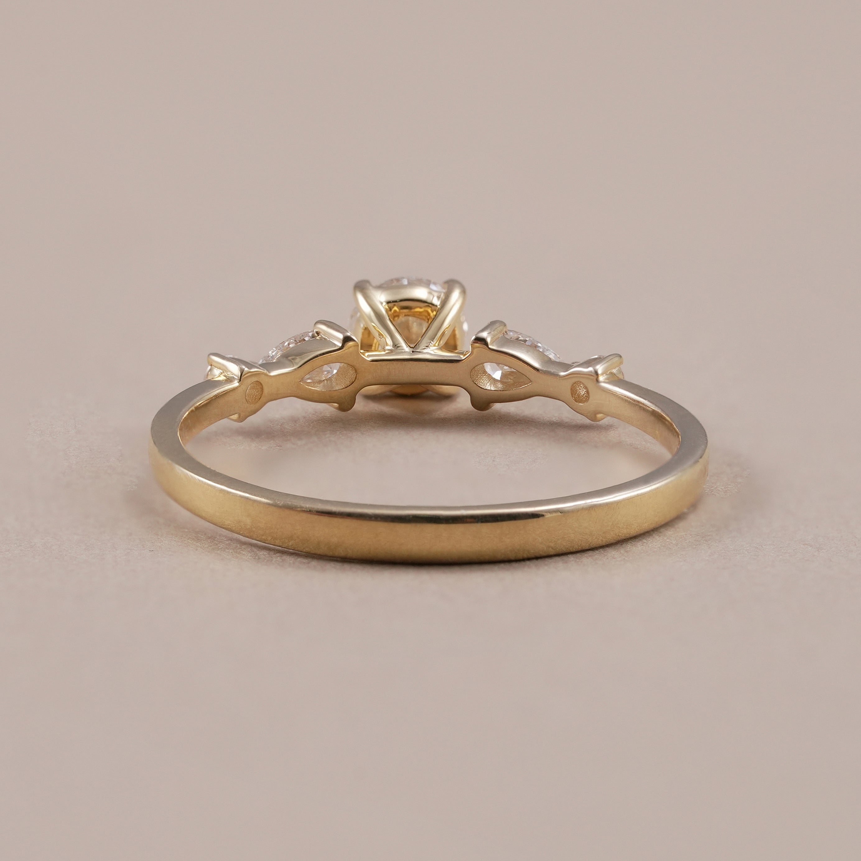 Elegant five stone engagement ring in yellow gold