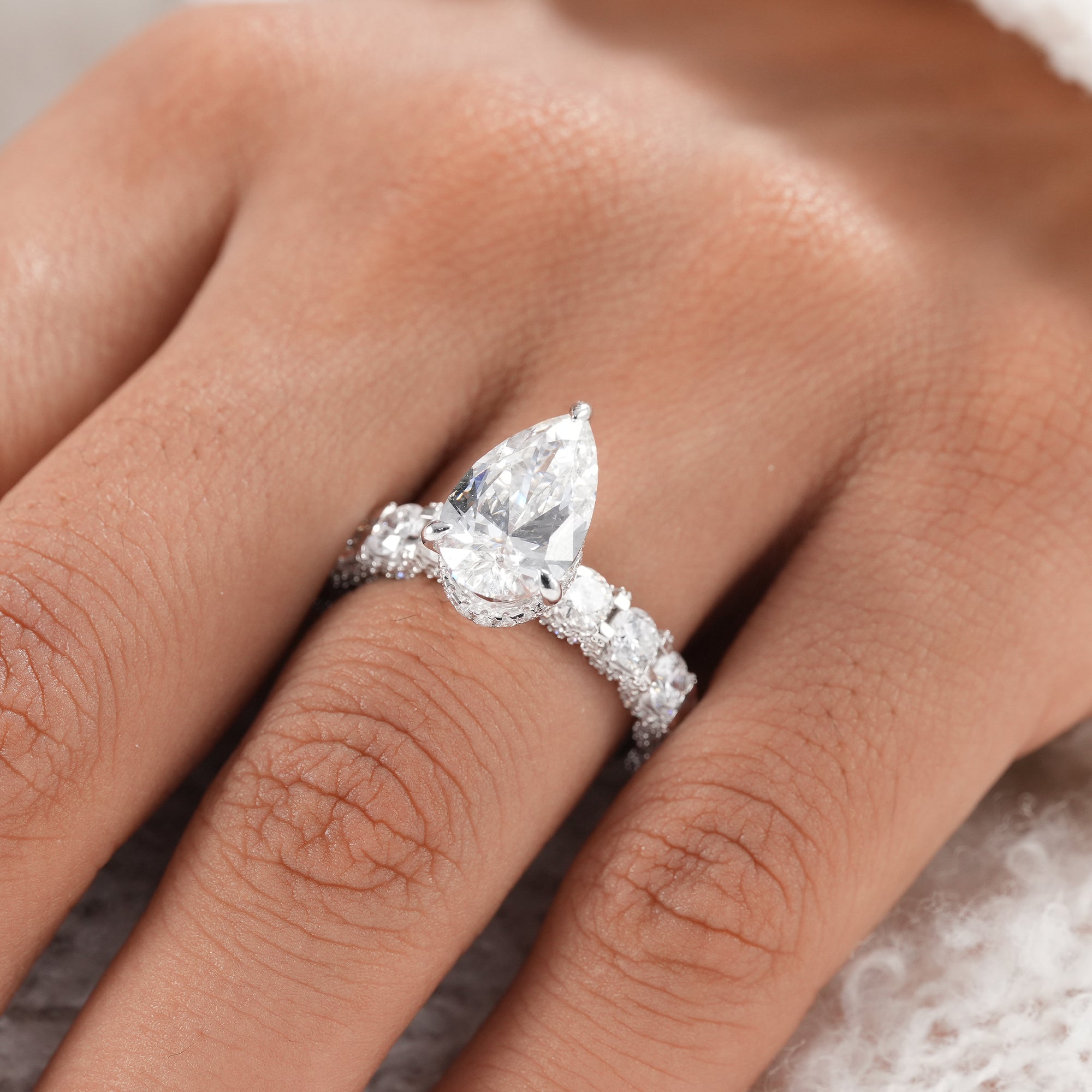 Premium pear diamond proposal ring for women.