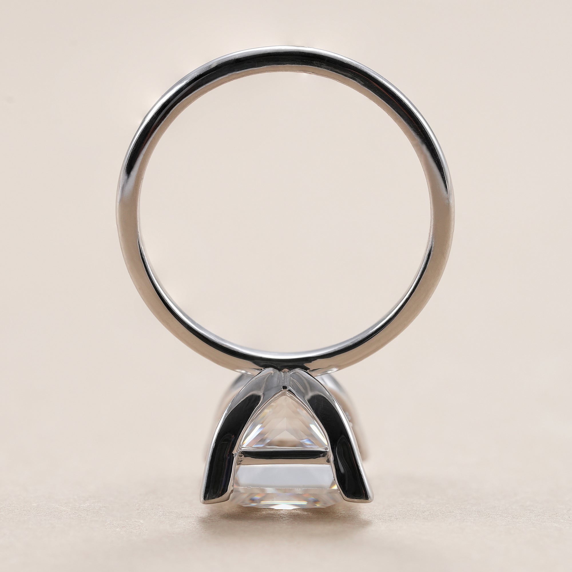 Elegant princess solitaire diamond ring handcrafted in white gold.