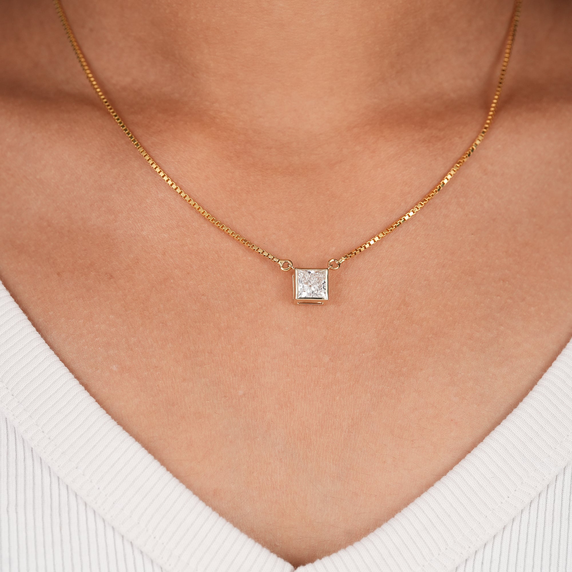 Princess cut lab grown diamond bezel pendant necklace in yellow gold