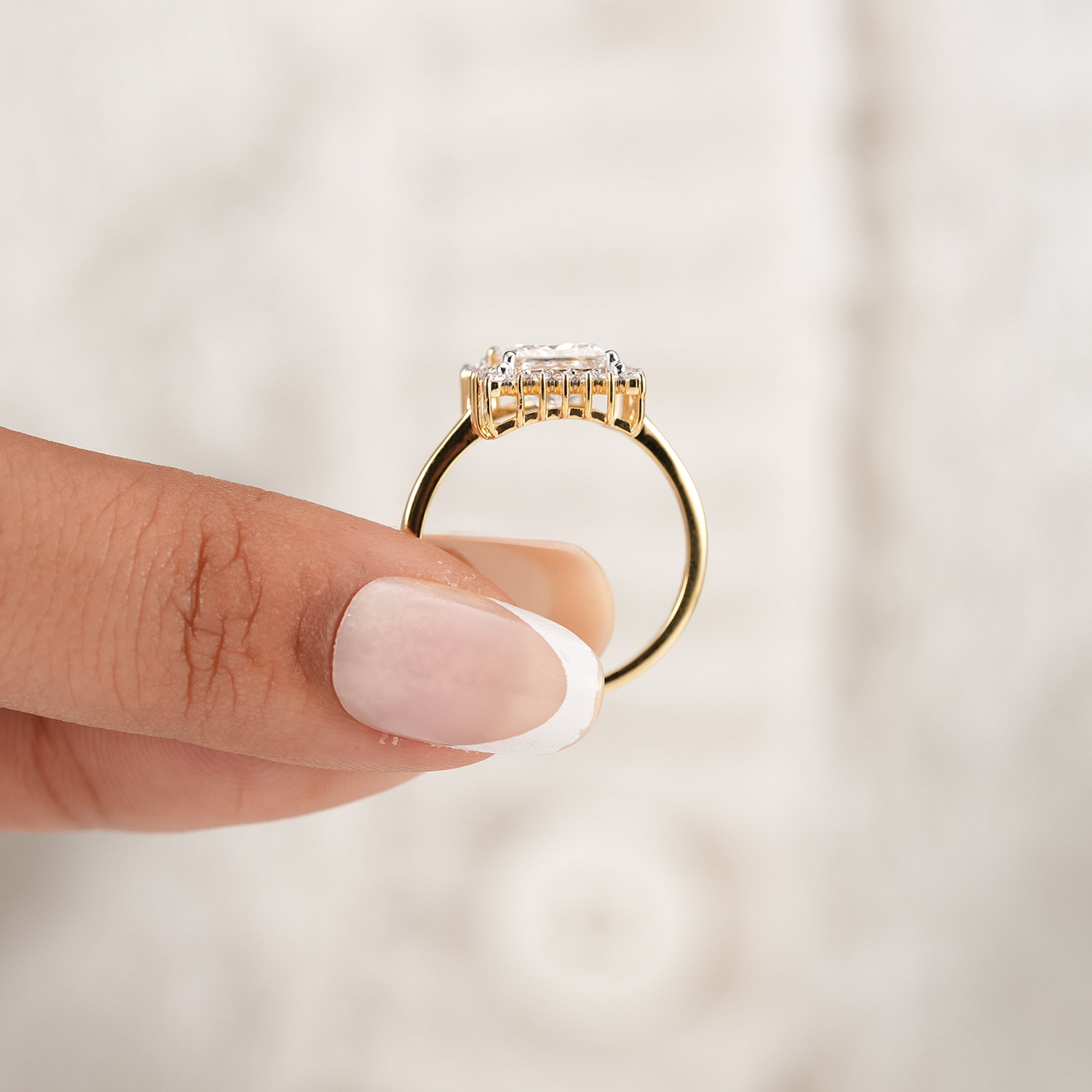 Princess cut solitaire halo engagement ring with brilliant diamonds