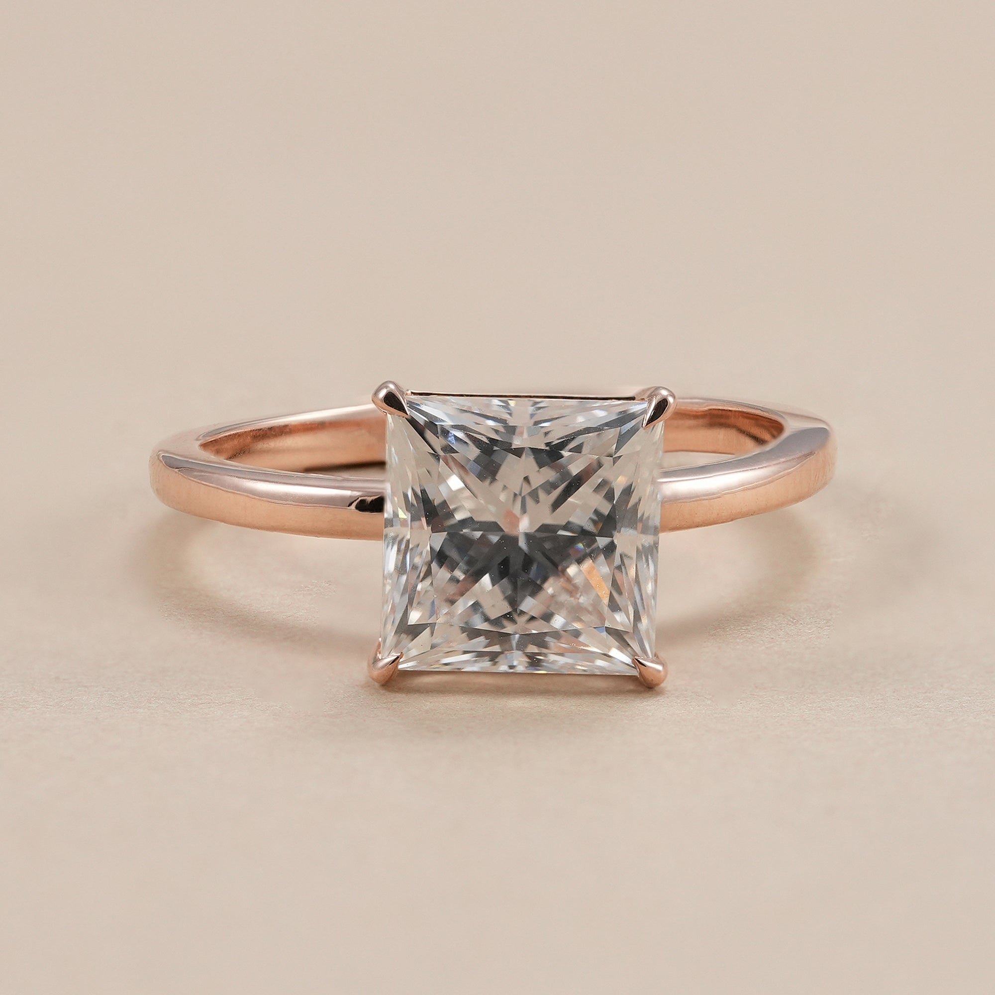 Princess diamond solitaire engagement ring with 3 CT lab grown diamond in rose gold.