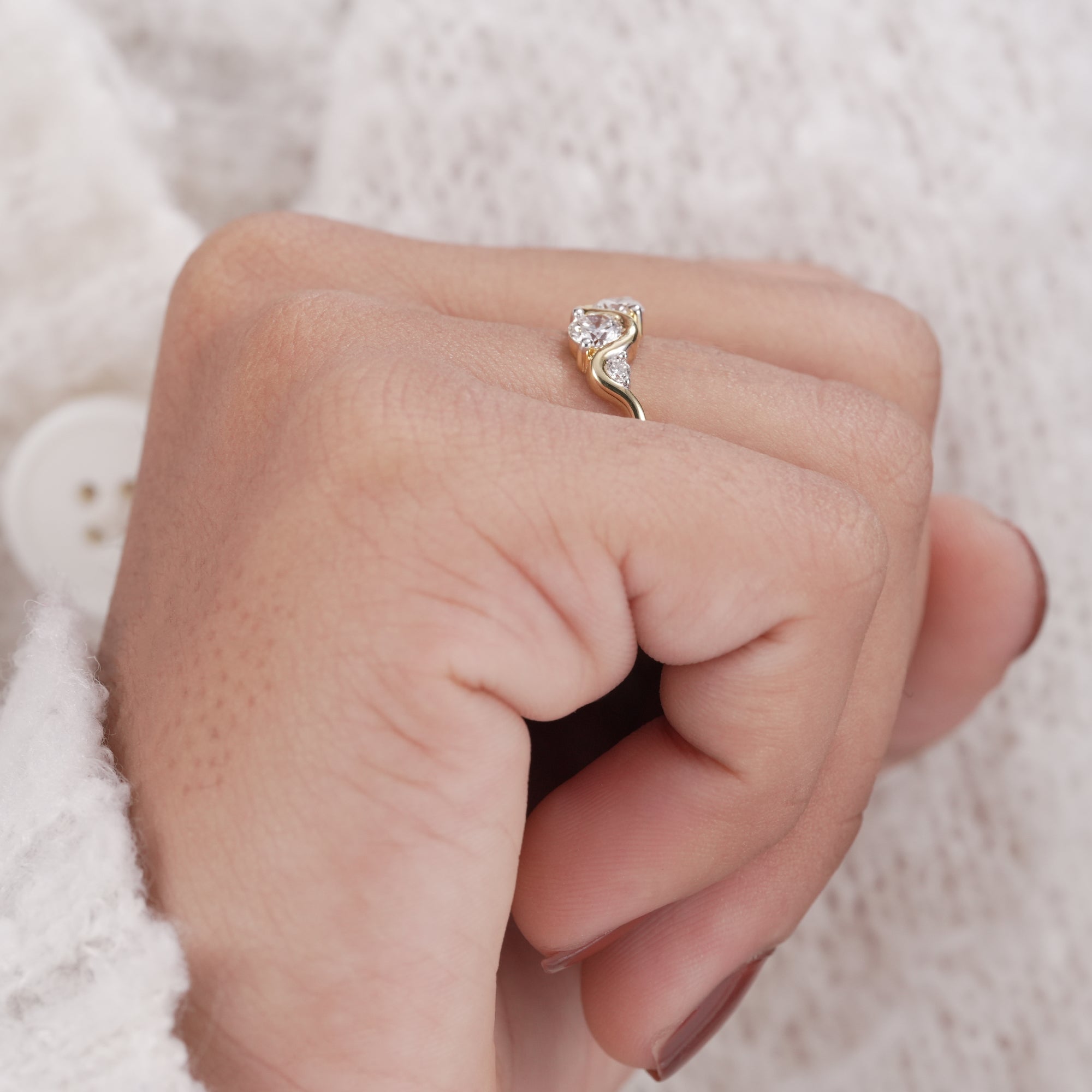 Minimalist round diamond ring for everyday luxury wear.