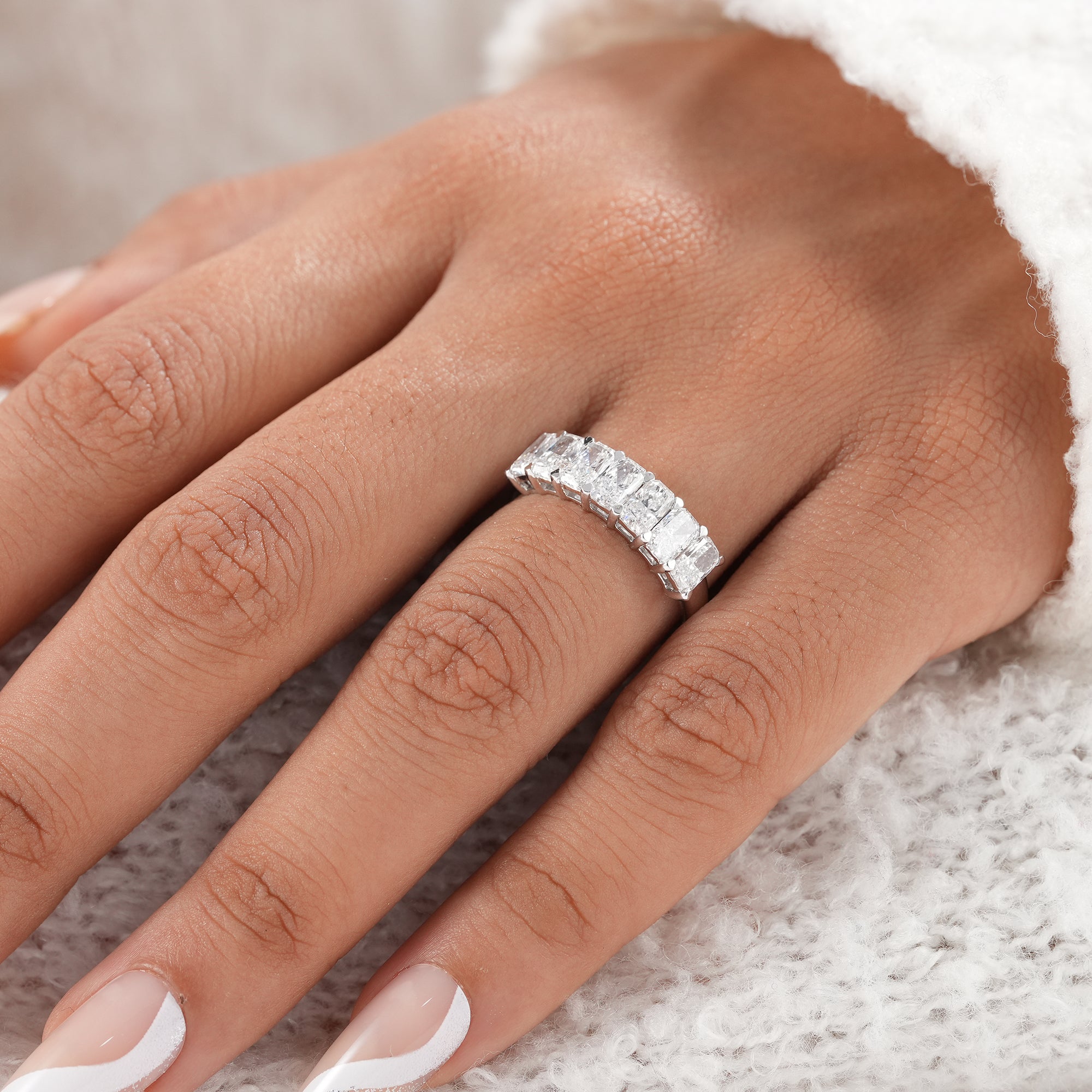 Fine jewelry radiant cut diamond wedding band.