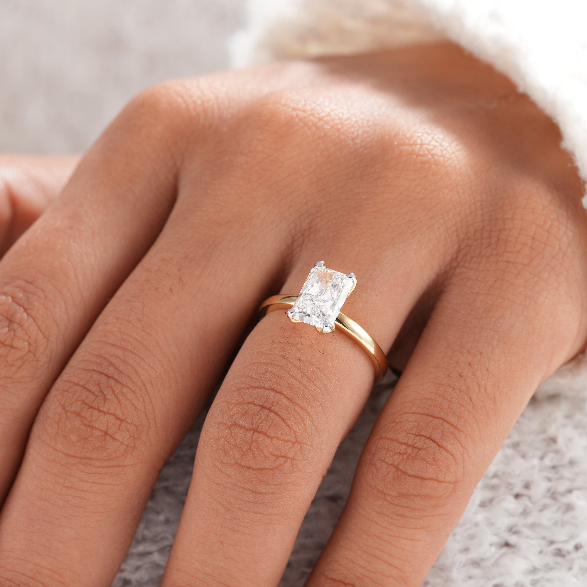 Sustainable radiant cut engagement ring in solid gold.