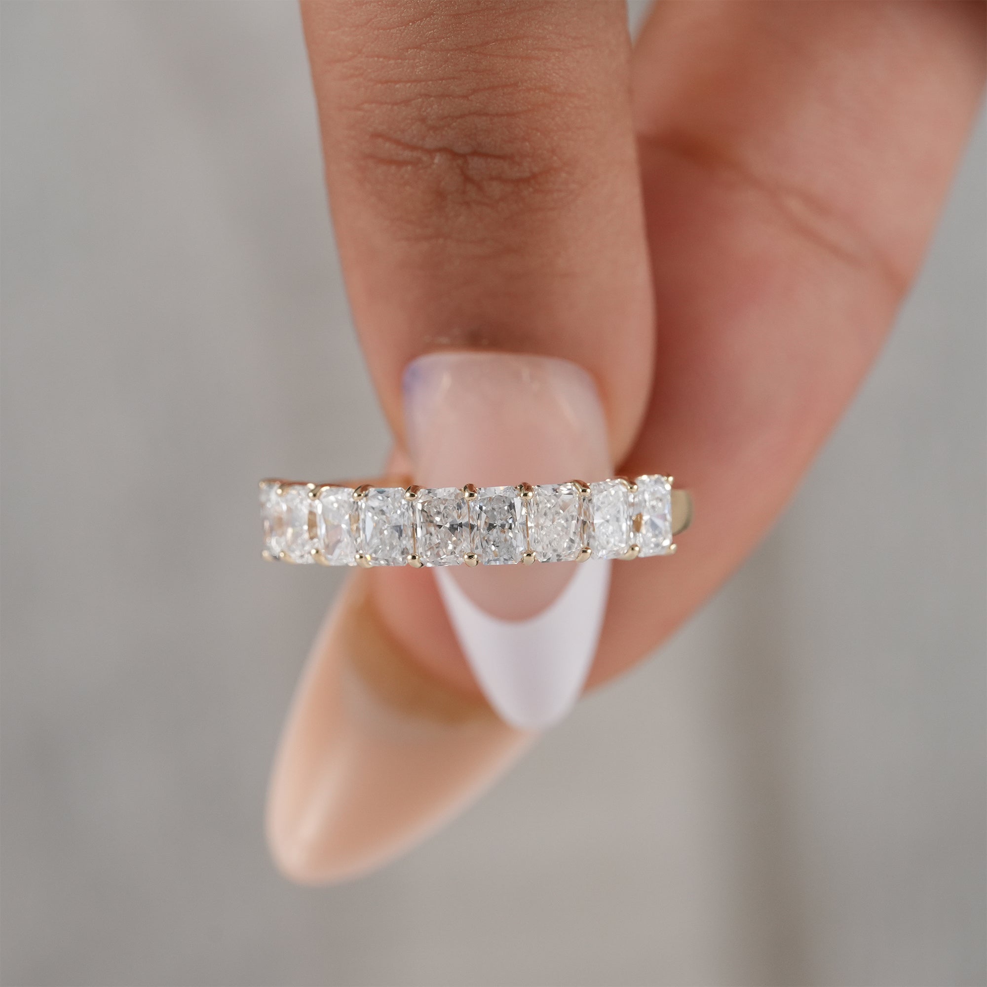 Stackable radiant diamond anniversary ring.