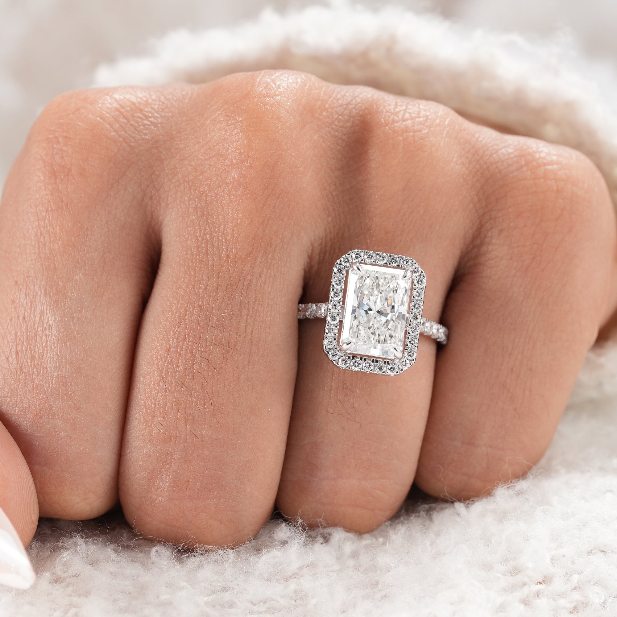 White gold radiant lab grown diamond engagement ring.
