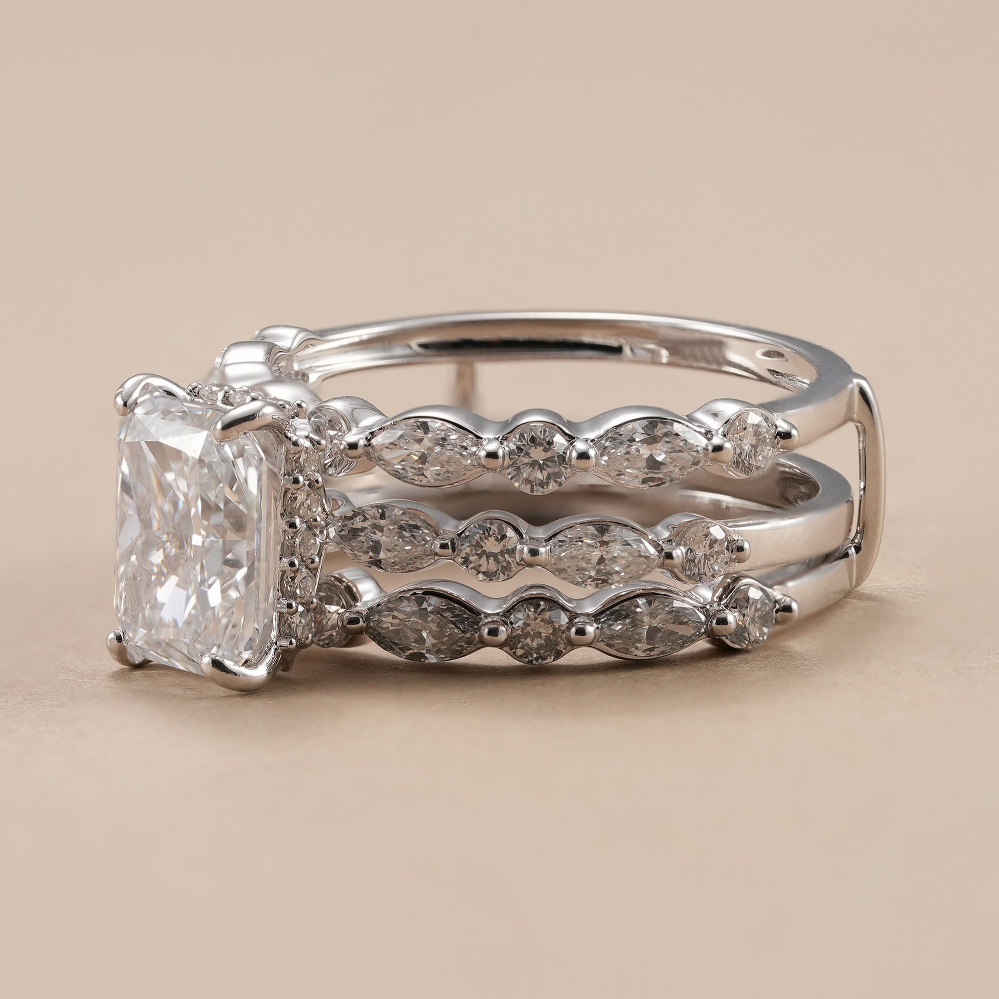 Three-piece radiant diamond wedding ring set in white gold.
