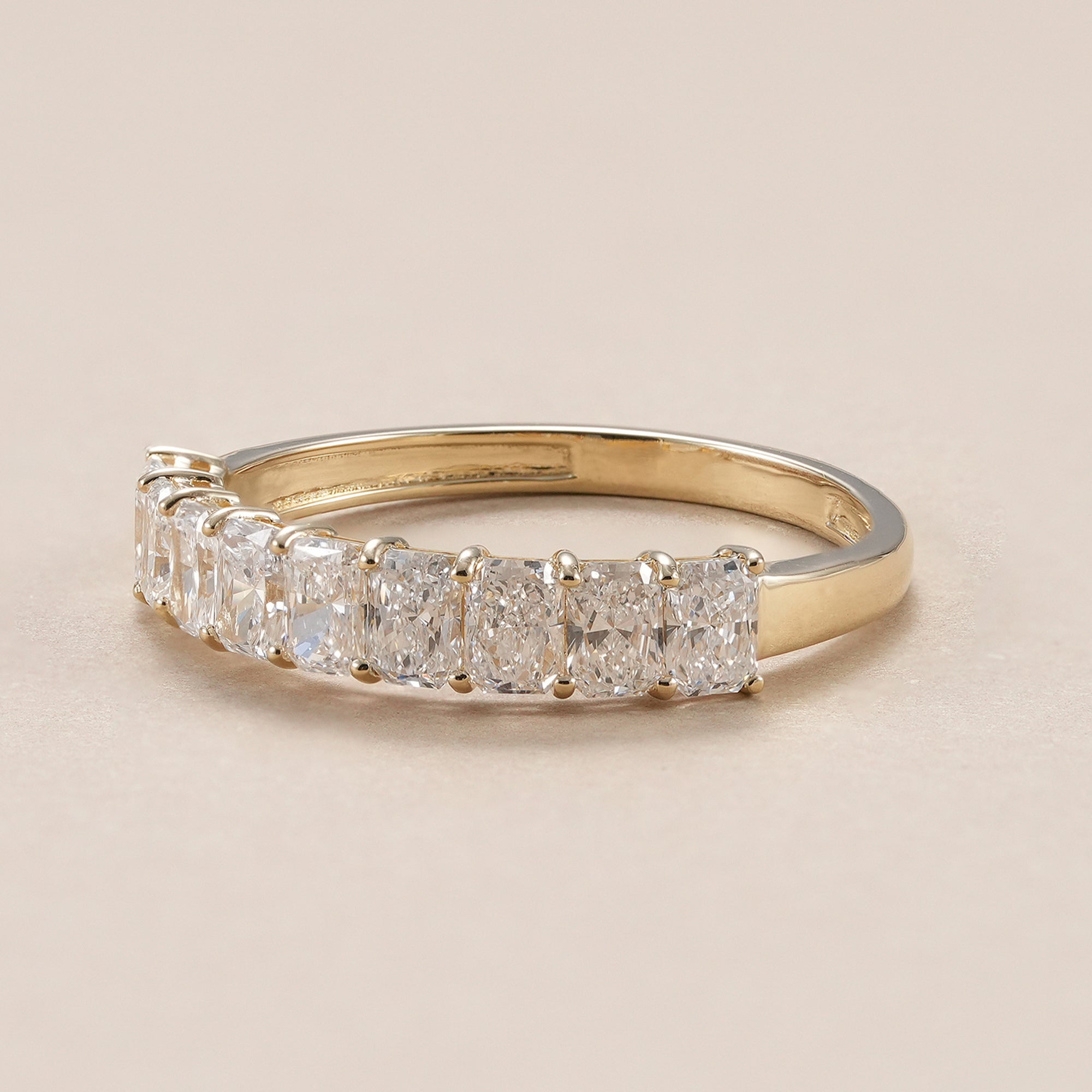 Minimalist radiant cut diamond eternity wedding ring.