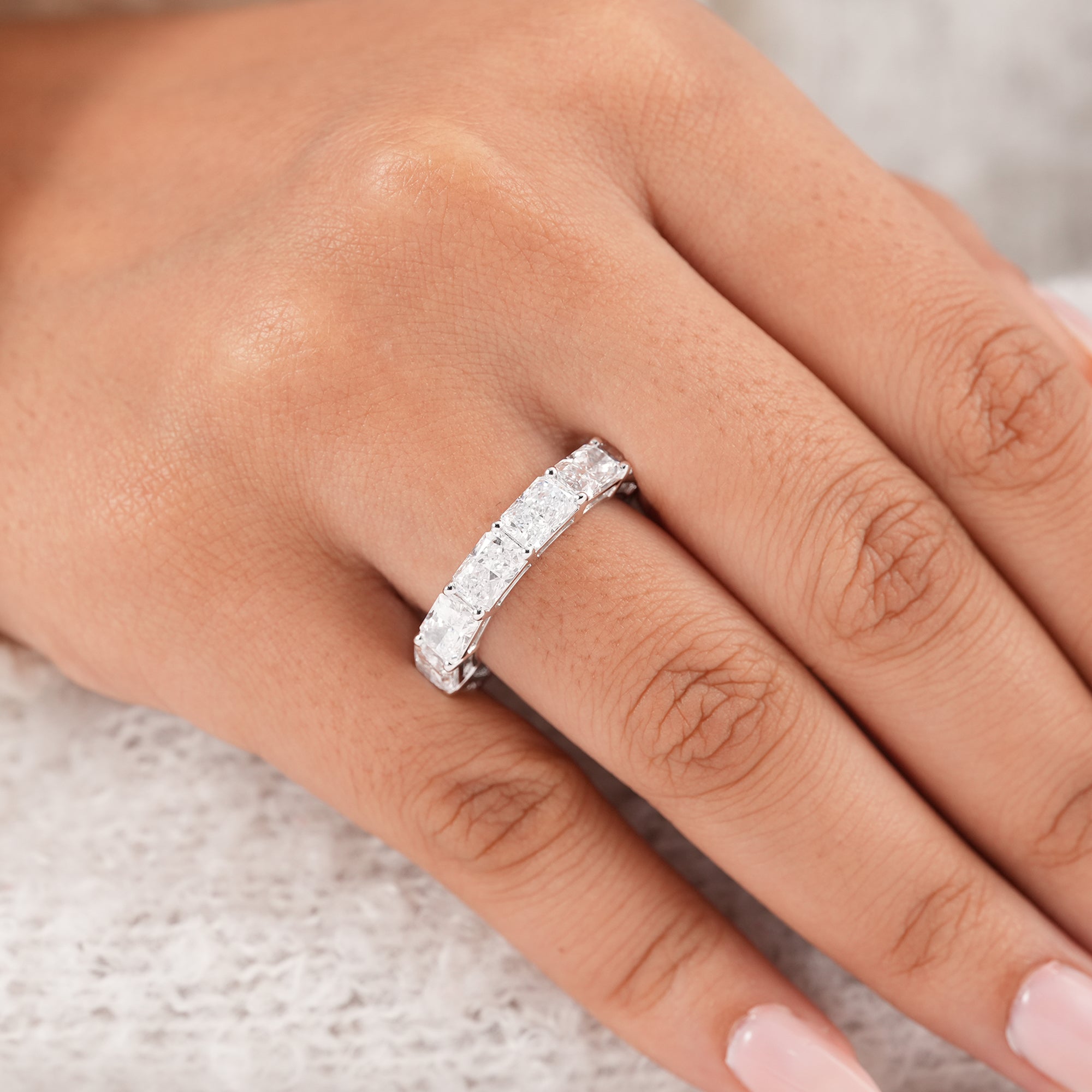 Elegant radiant diamond stacking ring with shared prong setting