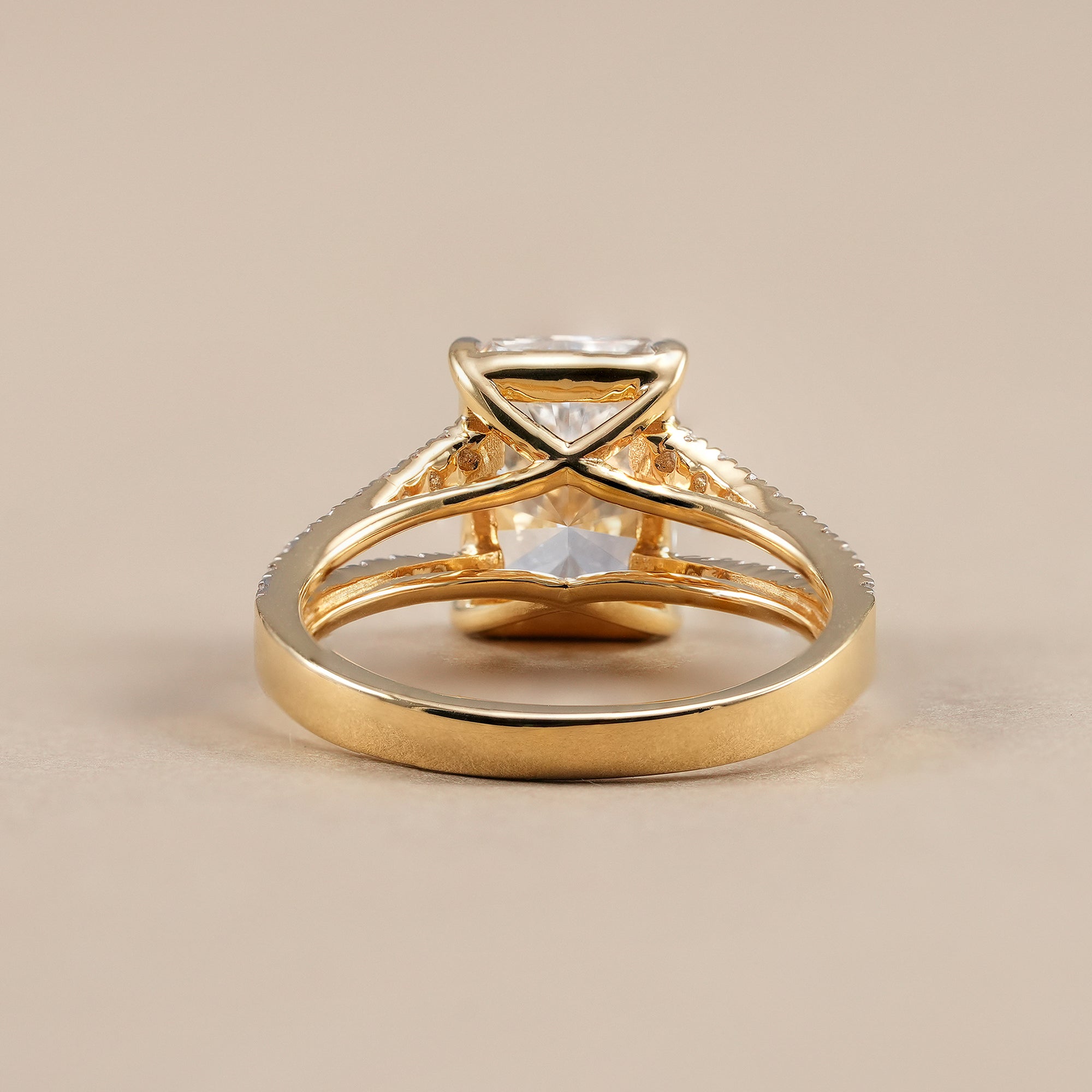 Radiant diamond proposal ring with split shank pavé band