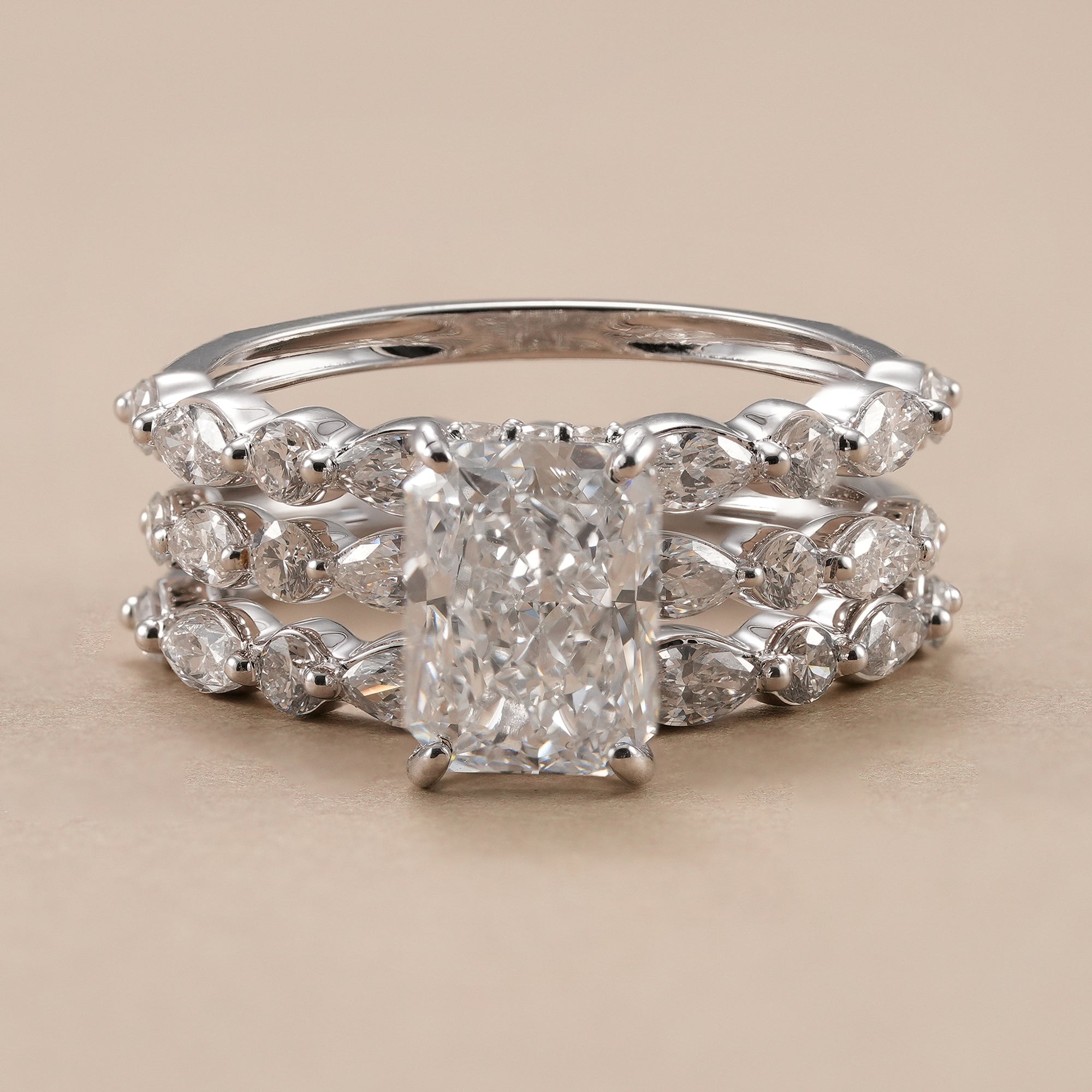 Radiant lab diamond wedding ring set with matching marquise and round bands.