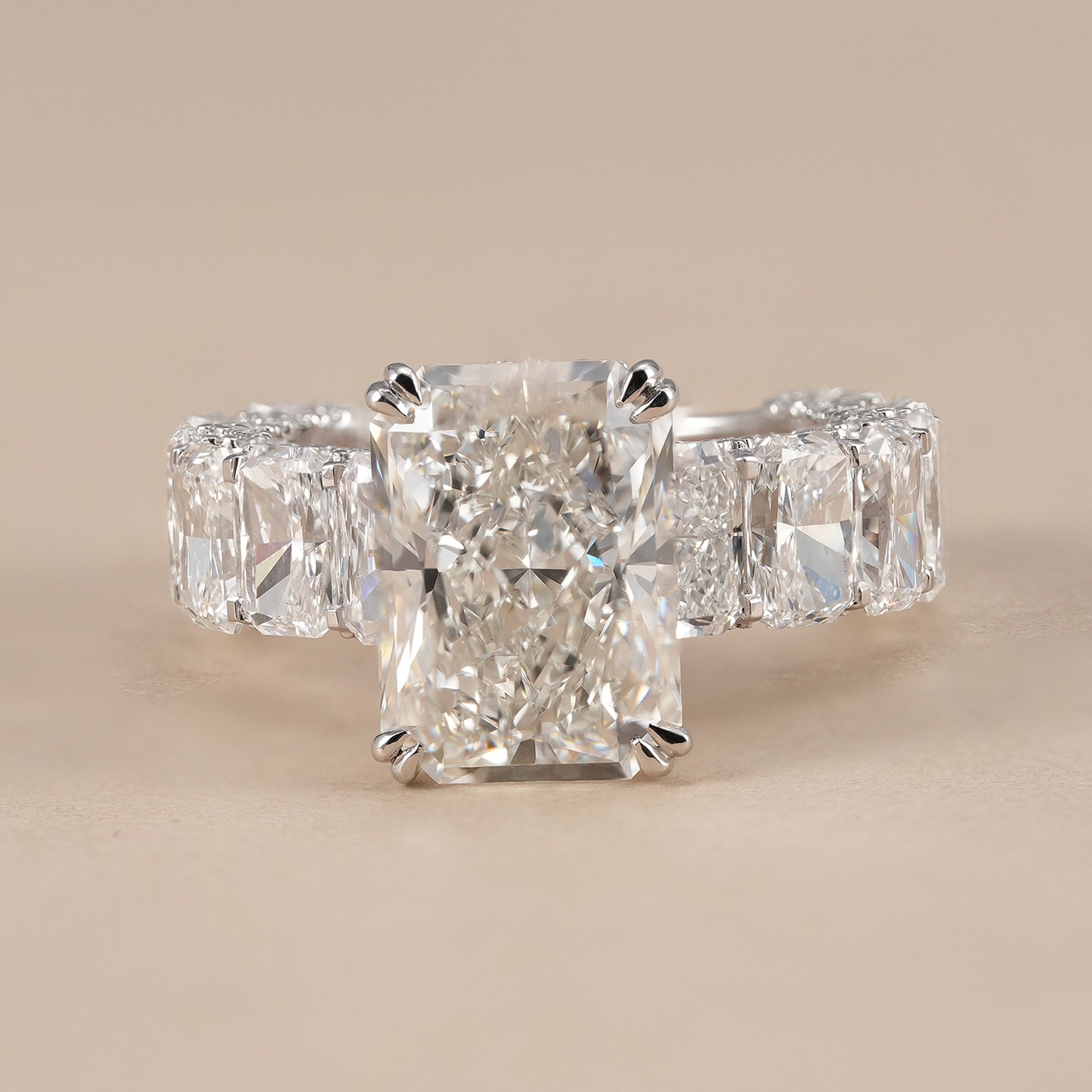 Radiant lab grown diamond engagement ring with radiant cluster band